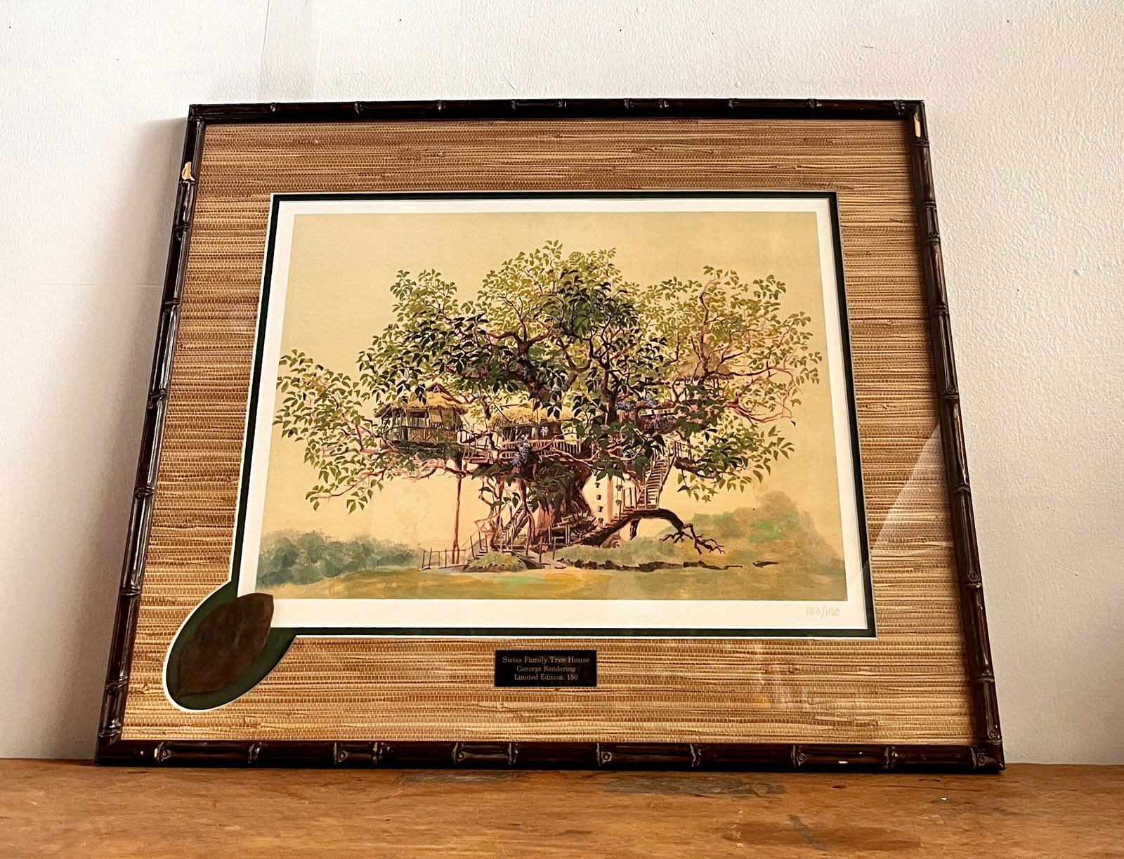 Swiss Family Tree House Framed Prop Leaf and Concept Art Print.: (Disneyland, 1999) This is a very rare original vinyl leaf prop from Disneyland's beloved Swiss Family Treehouse in Adventureland. The leaf was framed and offered by Disney along with printed concept 
