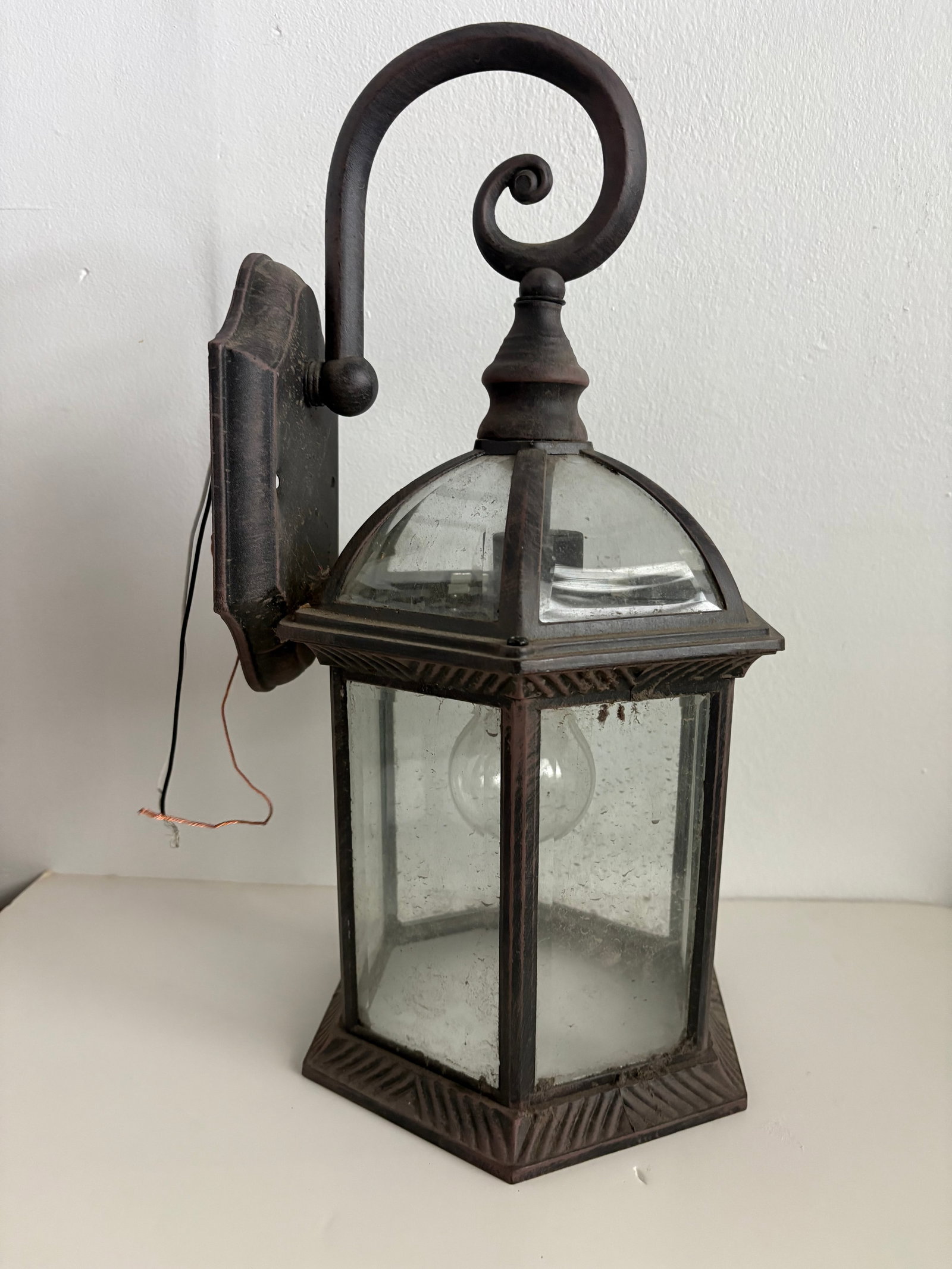 Disneyland Haunted Mansion Renovation Wall Sconce (2024): “Our tour begins here in this gallery…” with a lantern-style lamp which illuminated a Haunted Mansion Exhibit at Disneyland! This light was affixed to a temporary wall during a recent renova