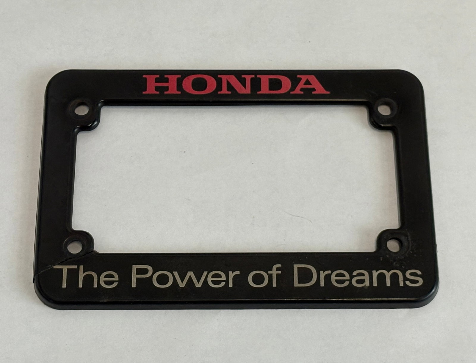 Disneyland - Autopia Mark VIII Honda License Plate Frame (Walt Disney, 2016-Present).: This style of instantly recognizable license plate frame promotes “The power of dreams” from the back of each Disneyland Autopia vehicle! “The power of dreams” When Disney teamed with 