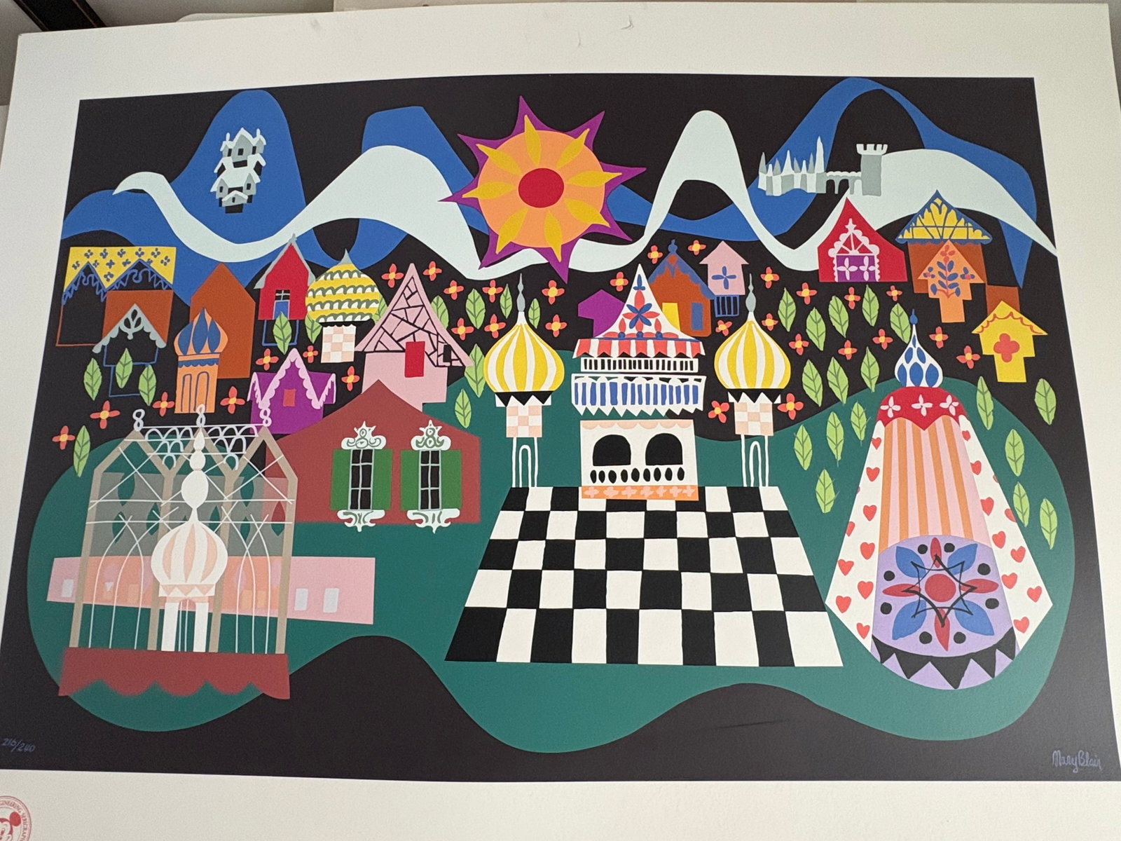Disneyland - Mary Blair “It's a Small World” Concept Serigraph Print LE #216/240: “Though the mountains divide”, there is just “one golden sun” over “A World of Dreams”, a rare, limited edition serigraph print by Mary Blair. In 1963, Walt Disney Imagineer Ma