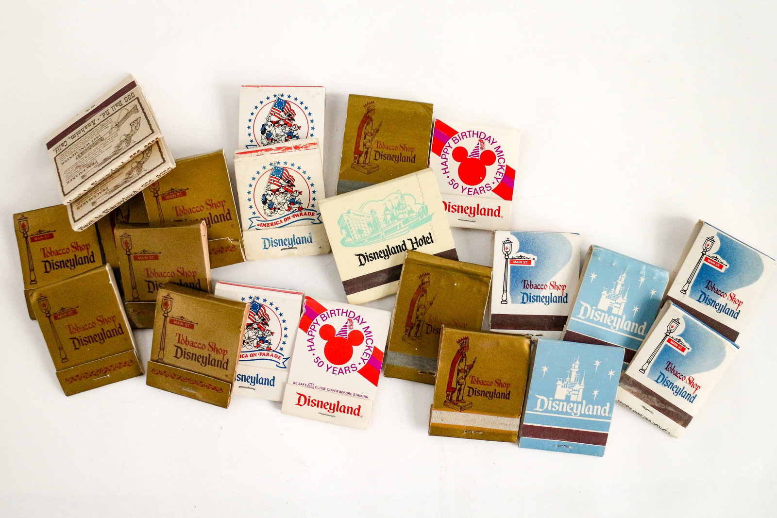 Collection of (22) RARE Disneyland Matchbooks (1960s-1970s): This collection of (22) complimentary matchbooks commemorates the bygone Disneyland Tobacco Shop! Among this medley of mementos are books celebrating Happy Birthday Mickey - 50 Years and America on Pa