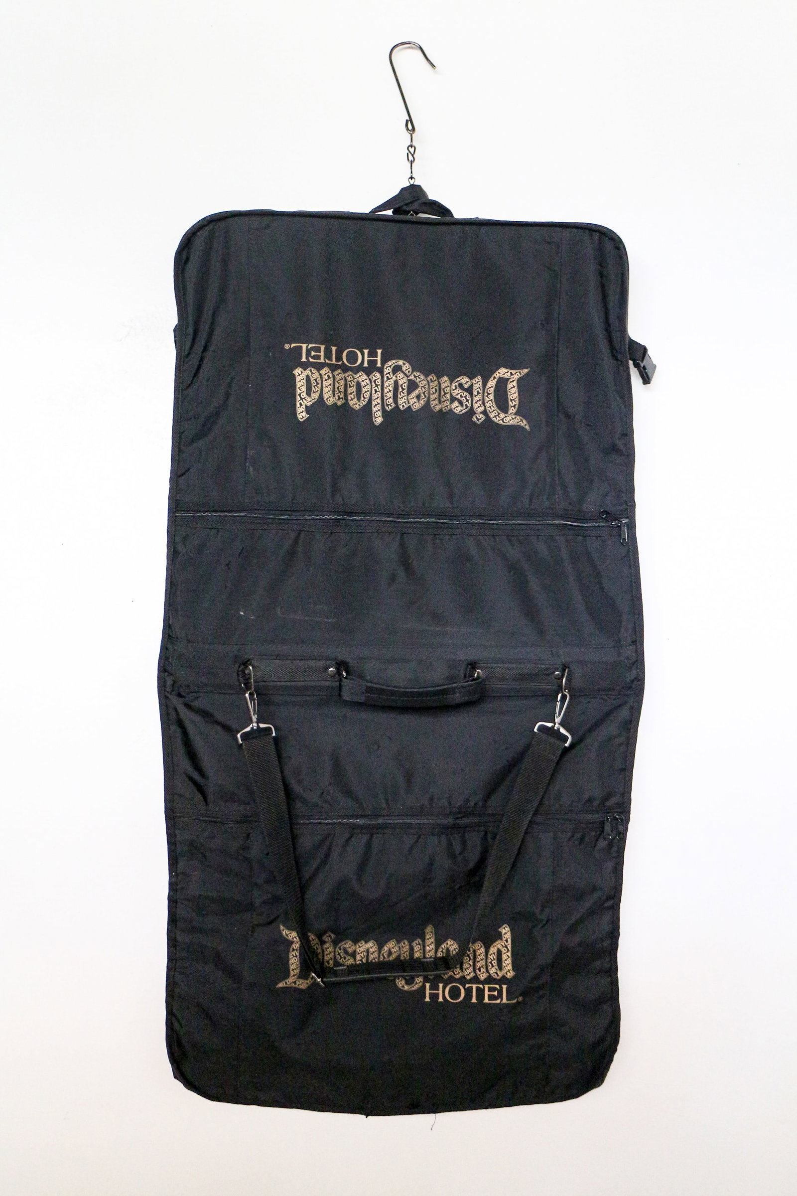 Disneyland Hotel - Travel Garment Bag (Walt Disney, c. 2005-2008): Travel in style with this vintage Travel Garment Bag from the fabulous Disneyland Hotel! Since 1955, the Official Hotel of the Magic Kingdom has offered modern and comfortable luxuries to rival other 