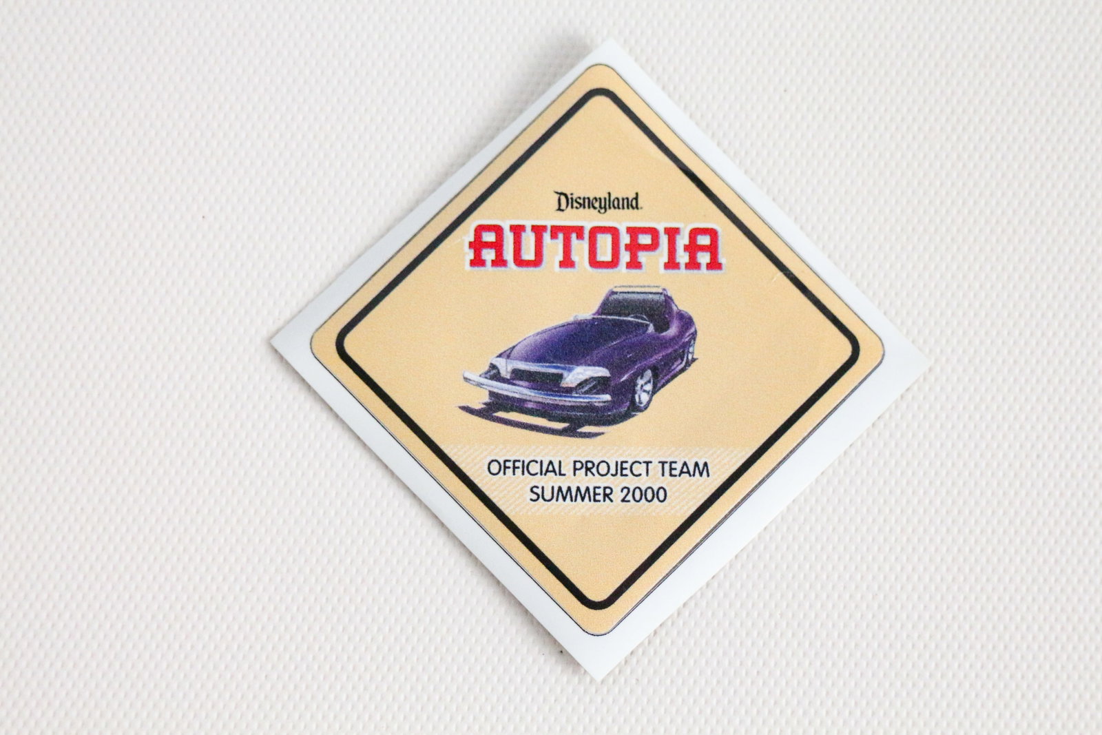 Disneyland - WDI “Autopia Project Team” Decal (2000): You’ll “start your engines” over this special decal proudly worn on the helmets of Walt Disney Imagineers for the re-imagined Disneyland Autopia! In 2000, Disneyland’s 45th birthday was