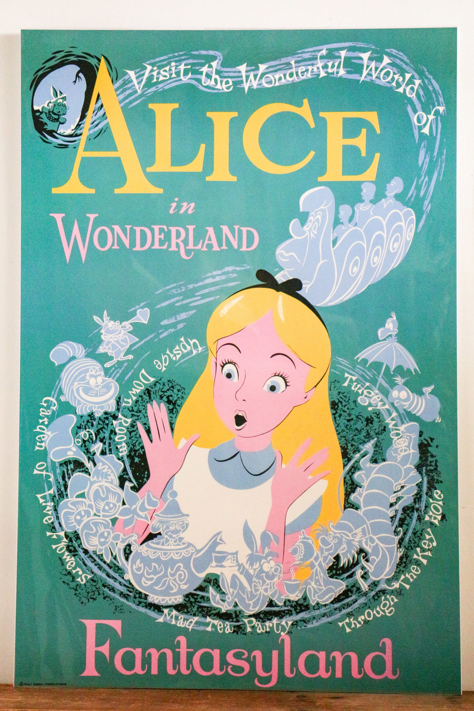 Disneyland - Disney Gallery Alice in Wonderland Attraction Poster Print (Walt Disney, 1990s - 2000s): "My adventures in Wonderland began when I followed a white rabbit down a rabbit hole." The Caterpillar and guests embark on a journey down the Rabbit Hole in this Disney Gallery Exclusive print commem