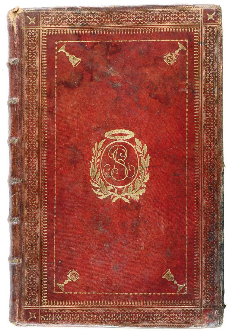 Dunkelroter Maroquineinband: des 18. Jh. mit umlaufenden floralen u. ornamentalen goldgepräg. Bordüren auf beiden Deckeln; Kreuze, Kelche u. Leuchter mit Jesus-Monogr. "IHS" als Eckverzierung, die sich auf dem Rück
