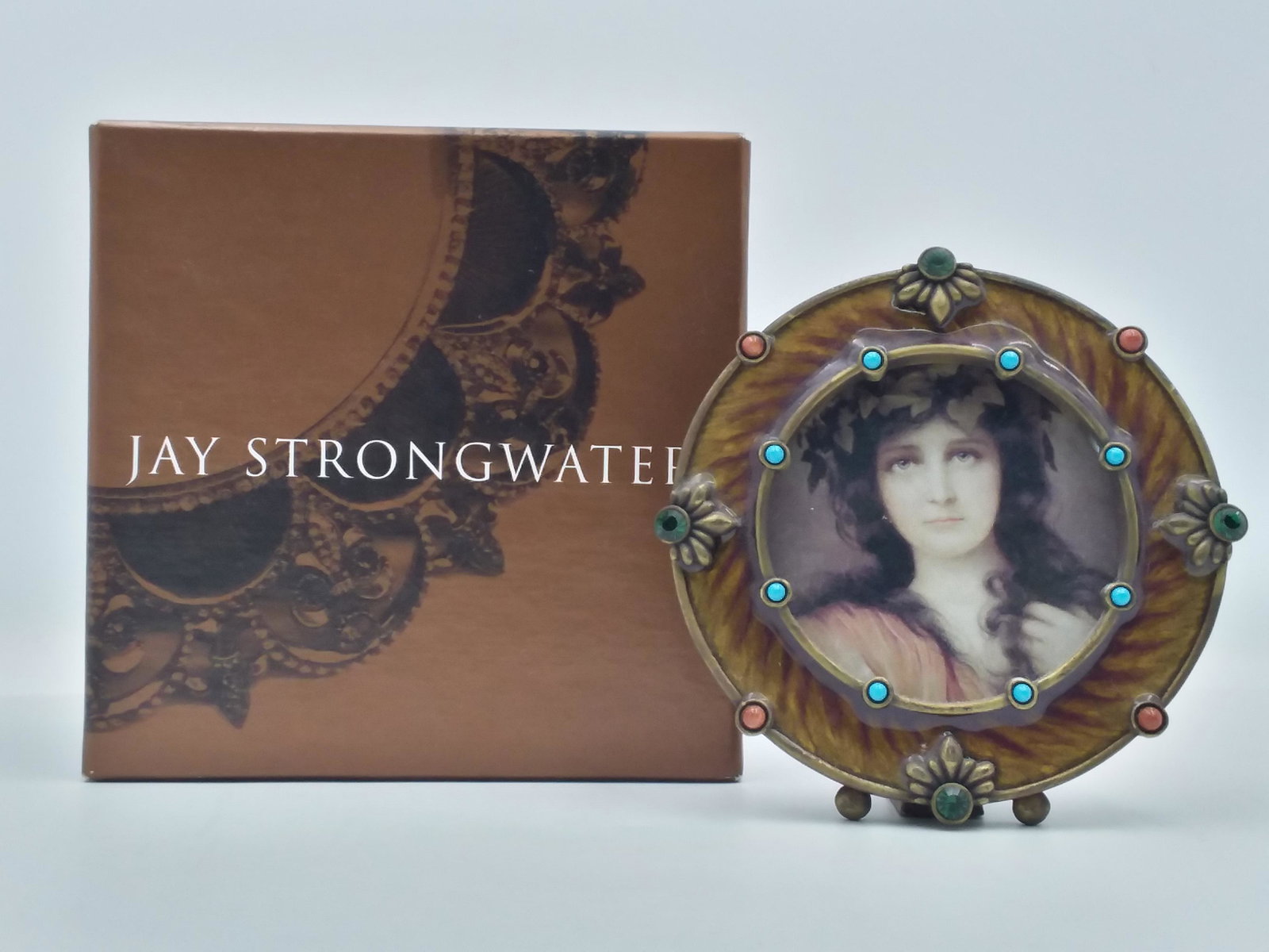 Jay Strongwater Round Jeweled Photo Frame: Jay Strongwater Jeweled Design Round photo frame, with original box & pouch. Adorned with Multi- Colored Crystals in Coral, turquoise, & emerald tones.