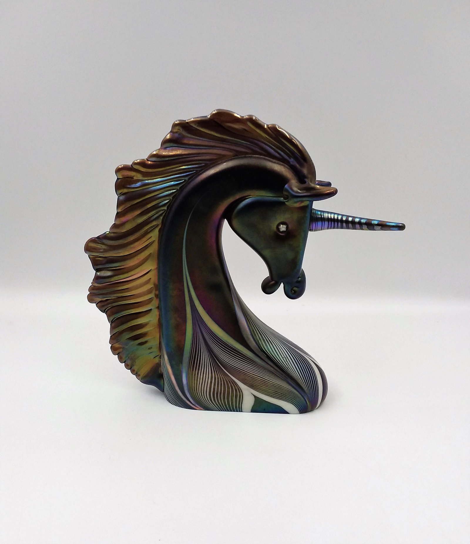 Stuart Ableman Art Glass Unicorn Sculpture: Irisdescent Purple Swirls Glass Unicorn Sculpture, Dated 1986 & Signed by Stuart Ableman.