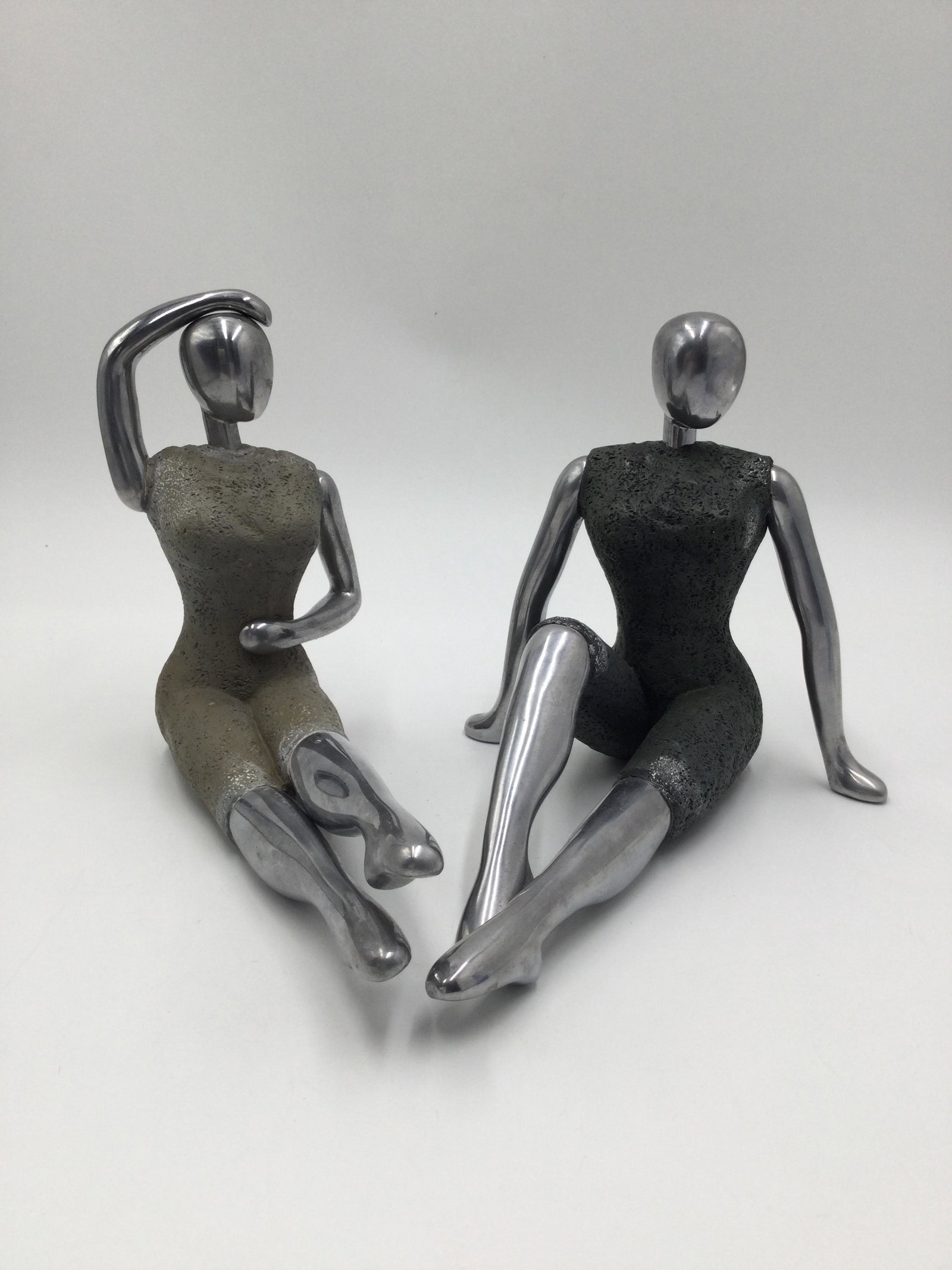 Stylized Modernist Female Mannequin Form Bookends: Stylized Modernist Female Mannequin Form Bookends, Unsigned, Materials used appear to be Lava rock & Aluminum. Size approximately - 8.75" & 6.5" tall each, could not find a tag or makers name. Could b