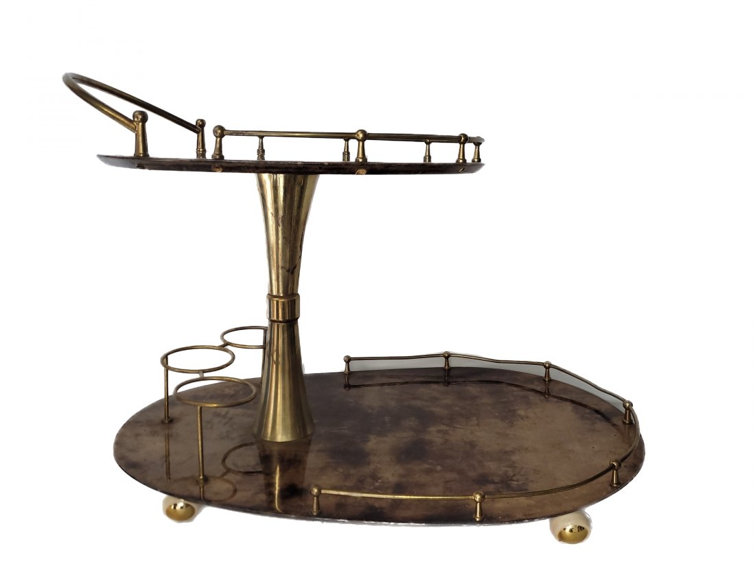 Aldo Tura Goat Skin Bar Cart: MCM Aldo Tura Goat Skin Bar Cart with brass accents. Approximate size: 23 in. tall x 21 in. wide x 30 in. deep - approximate weight 15 pounds. Free pick-up at our warehouse. Shipping is done by a 3rd