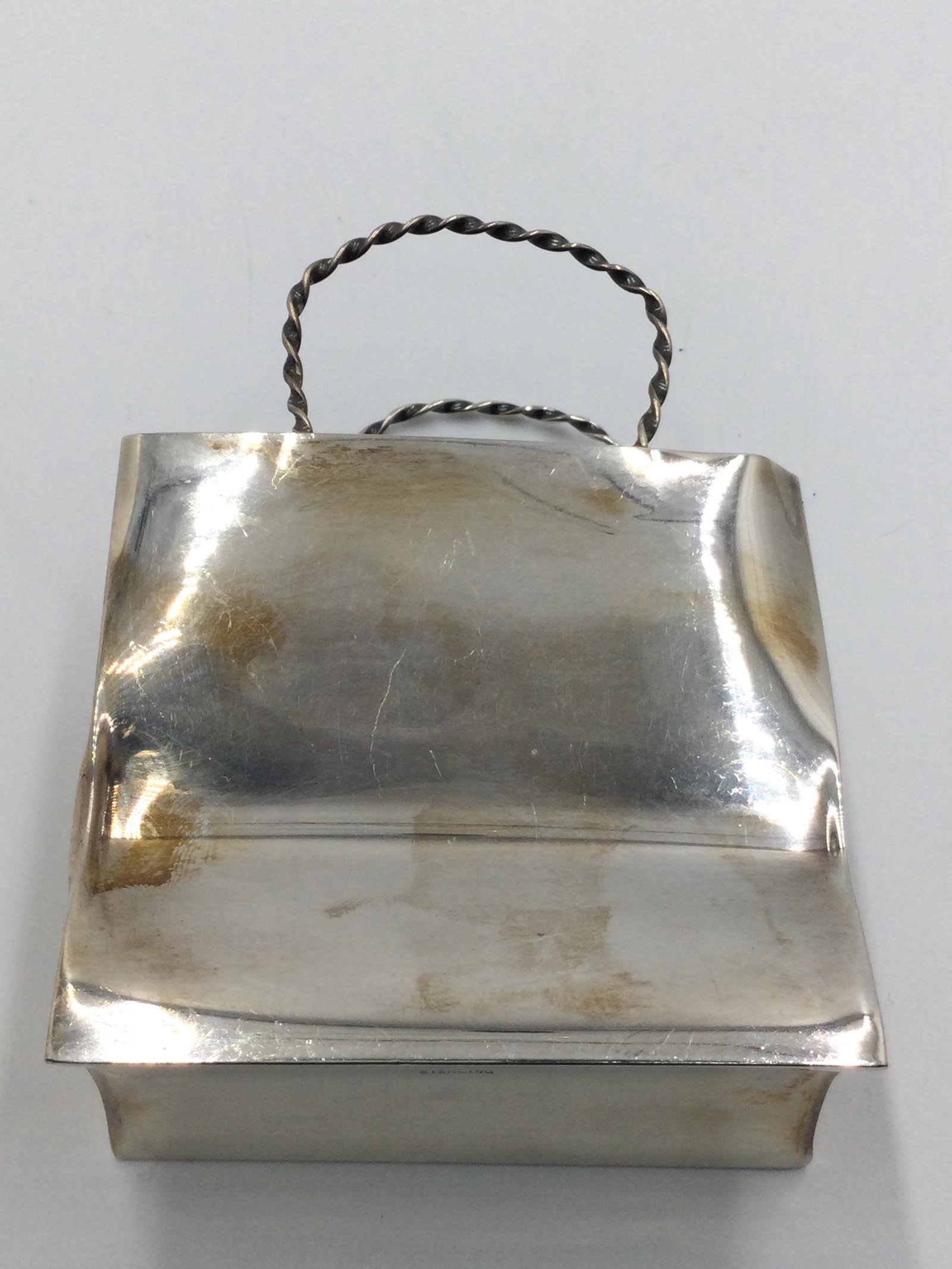 Cartier Sterling Silver Mini Shopping Bag: Cartier Sterling Silver Bag. Measurements: 3.75" tall x 1.75" length x 3" wide, approximate weight 87.7 grams. Free pick-up at our warehouse. Shipping is done by a 3rd party shipper and will be invoic