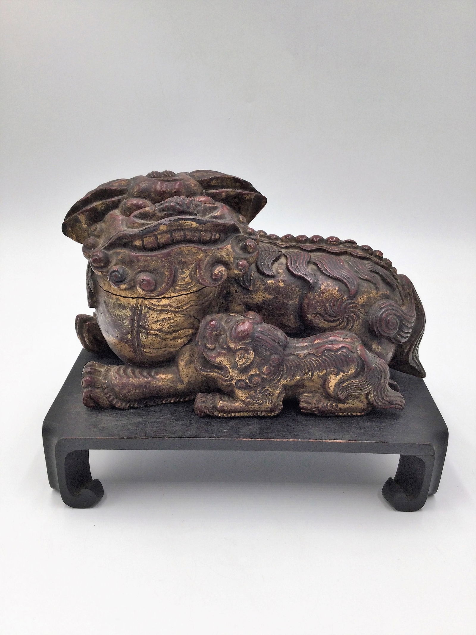 Chinese Wood Carved Foo Dog on Stand: Chinese Wood Carved Foo Dog on Stand. Measuring approximately 5.5 Inches Tall x 8 inches long. Free pick-up at our warehouse. Shipping is done by a 3rd party shipper and invoiced separately, please re
