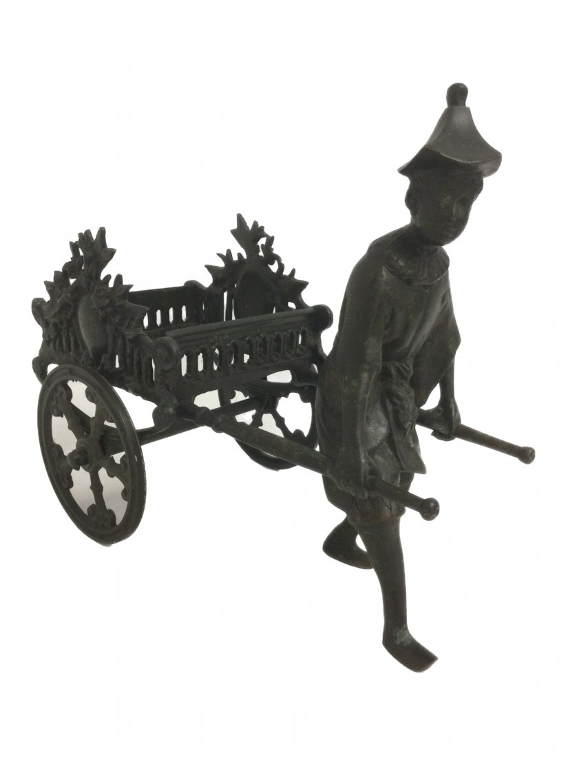 Chinese Bronze Rikshaw by Castillian: Chinese Bronze Rikshaw by Castilian. Measuring 10.5 tall x 5.5 wide x 12 long, weight 7 pounds. Opening for vase or candle placement 5 x 5 inches.