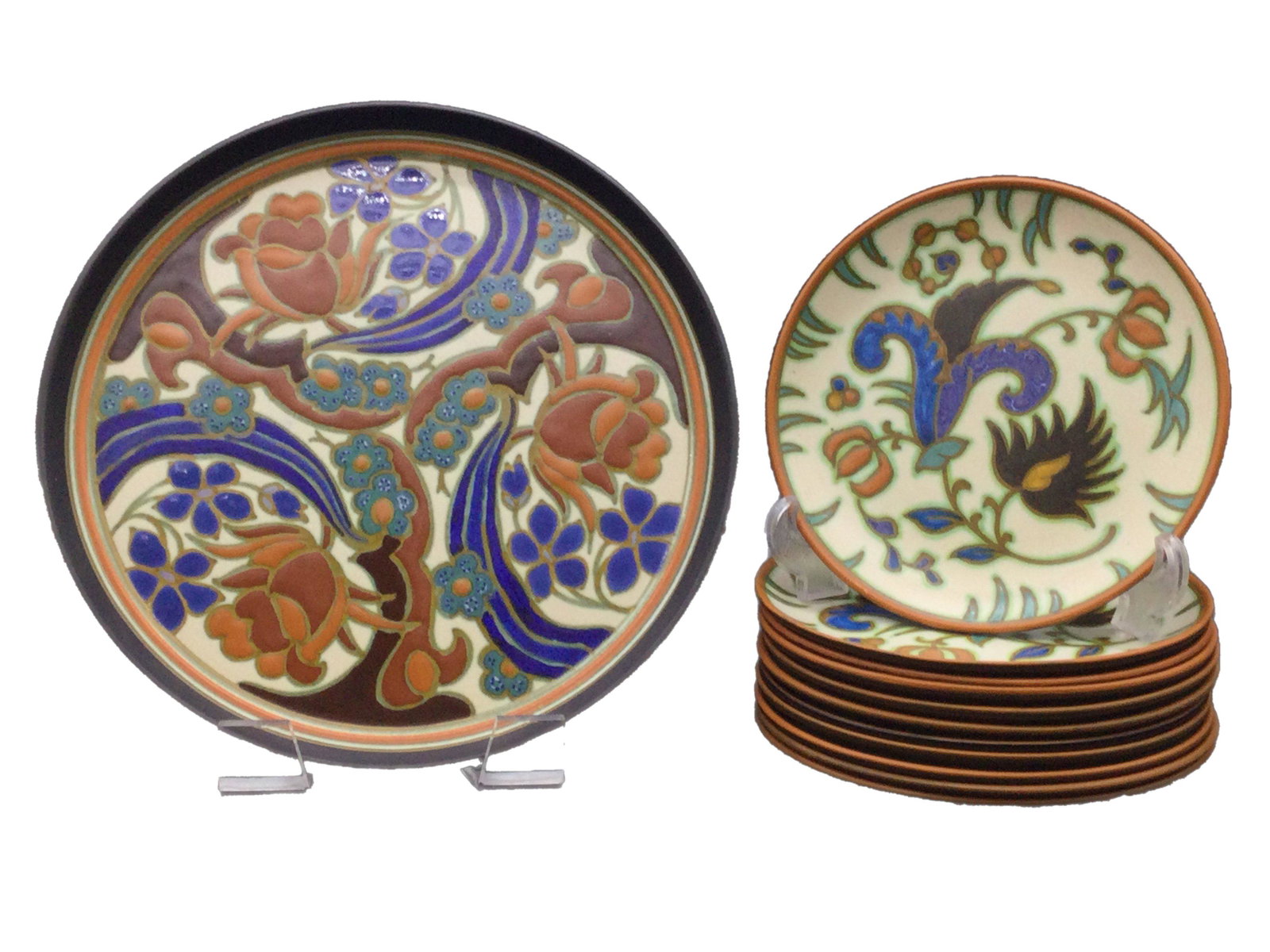 1920's Dessert Plates Set Gouda Holland Floral Pattern: 1920's Gouda Holland Dessert Set, consisting on a cake plate and 11 dessert plates. Measuring Approximately (cake plate) 11.75 across, (dessert plates) 7.75 across. Weighit 9.7 lbs. For Shipping pleas