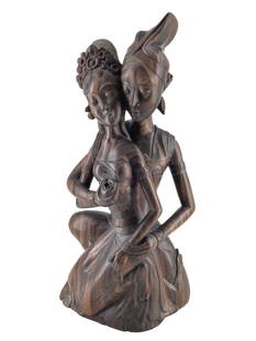 Polynesian Carved Ironwood Sculpture: Carved Polynesian couple embracing Ironwood sculpture from Sunar, Bali Signed I.B. Catra. Approx. size 18 inches tall x 9.5 wide x 4.5 deep. Approx. weight 10 lbs. 5 oz. IMPORTANT: For Shipping,