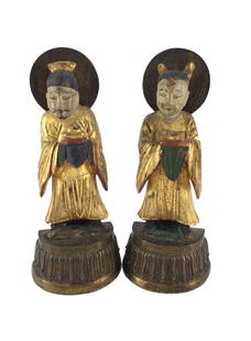 Chinese Carved Wooden Bookends On Brass: Asian male and female couple carved from wood on brass bookends. Approx. size 8 inches tall x 3.5 wide x 4 deep. Approx. weight 2 lbs. 5 oz. IMPORTANT: For Shipping, please contact our provider; The