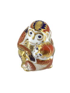 Royal Crown Derby Mother Monkey with Baby: Blue, auburn, gold, and white Mother holding baby monkey made by Royal Crown Derby. Approx. size 3.75 inches tall x 3.25 wide x 3 deep. Approx. weight 6.3 oz. IMPORTANT: For Shipping, please contact o