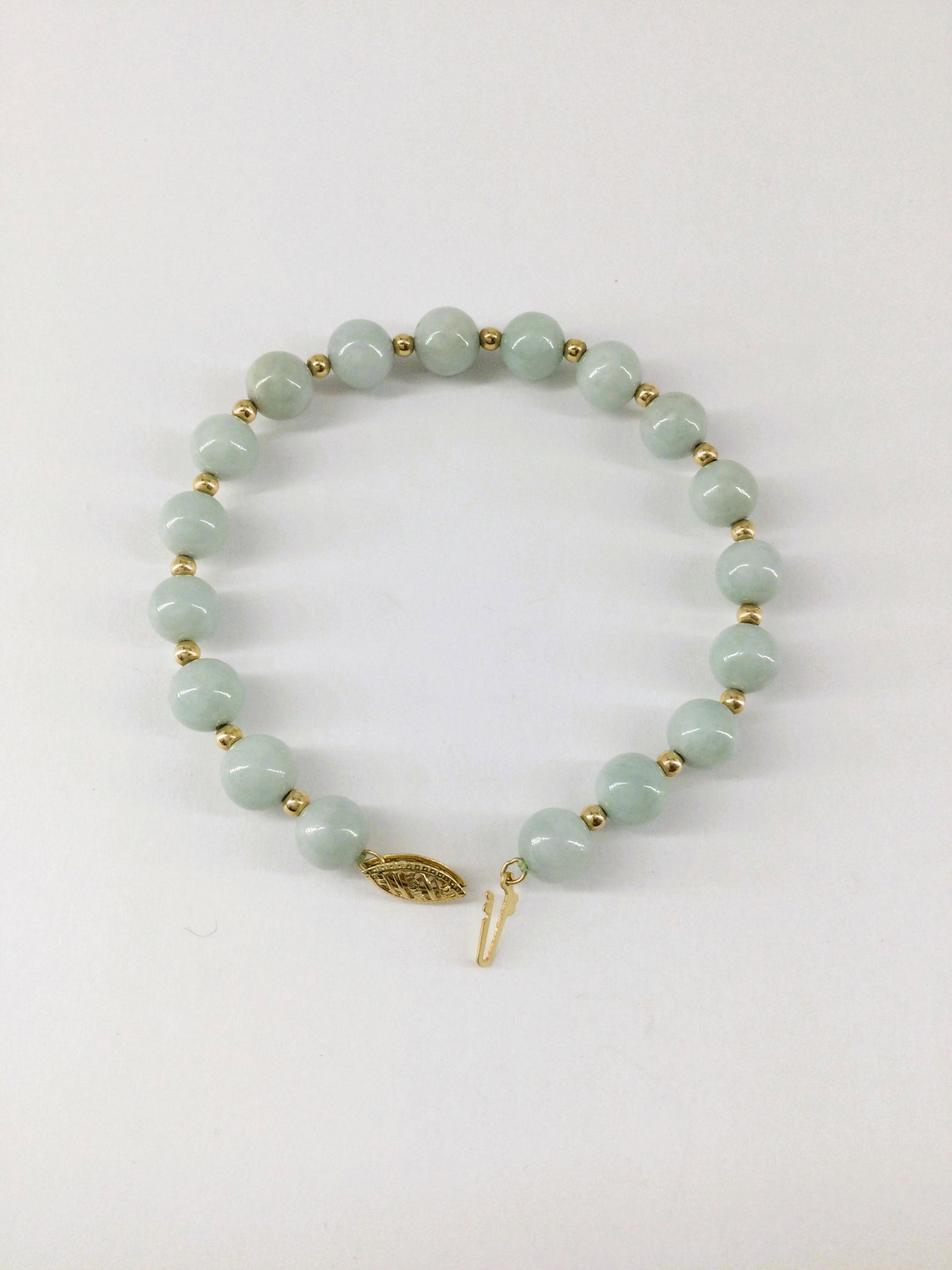Jade Bracelet WIth 14k Clasp by GSJ: 8 Inch Jade Bracelet with 14k Clasp signed GSJ, 8mm Jade beads. Approx weight 0.6 oz. IMPORTANT: In House Shipping.