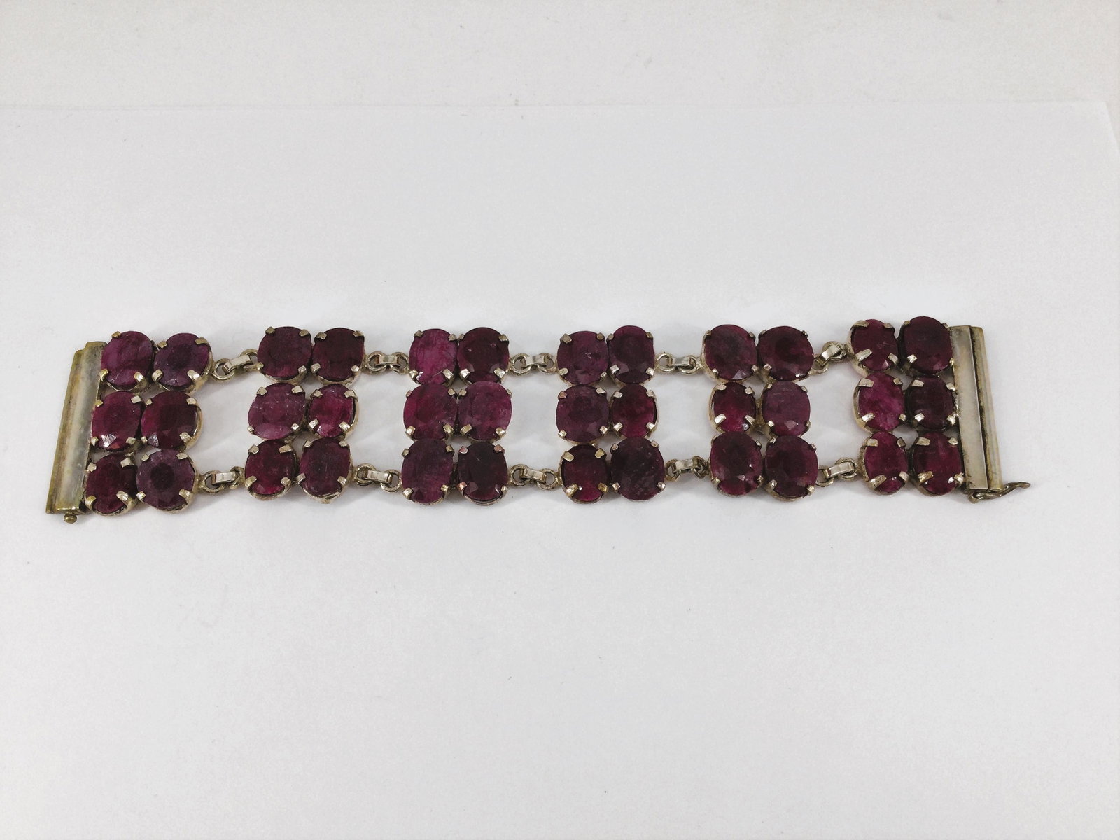 Sterling Silver and Ruby Red Beryl Triple Row Bracelet By Isabella: Isabella Ruby Red Beryl Bracelet 7.5 inches. Approx. weight 2.9 oz. IMPORTANT: In House Shipping.