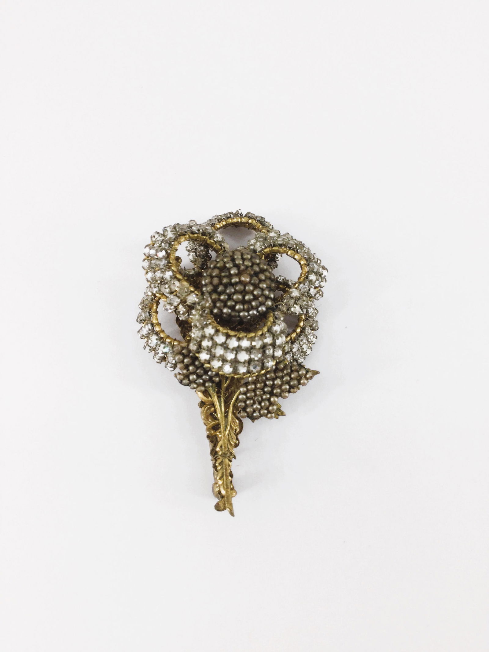 Miriam Haskell Rhinestone Brooch Signed: Vintage 1940's Miriam Haskell rhinestone flower brooch signed. Approx. size 2.5 inches tall x 1.5 wide. Approx. weight 0.7 oz. IMPORTANT: In House Shipping.