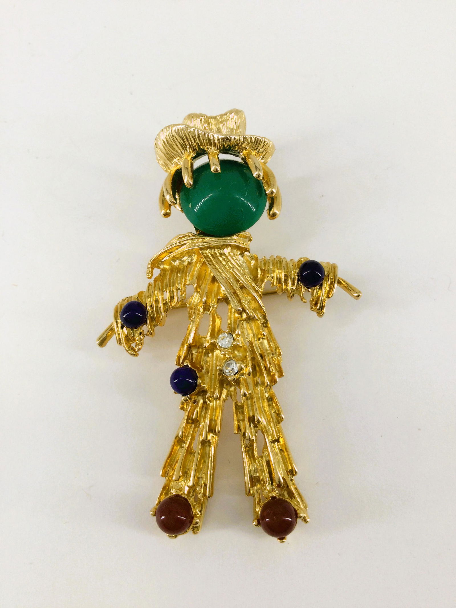Vintage Gold tone Erwin Pearl Scarecrow Rhinestone Brooch: Vintage Erwin Pearl Gold Tone Rhinestones & Cabochons Scarecrow Brooch. Approx. size 2.5 inches tall x 1.75 wide. Approx. weight 0.6 oz. IMPORTANT: In House Shipping.