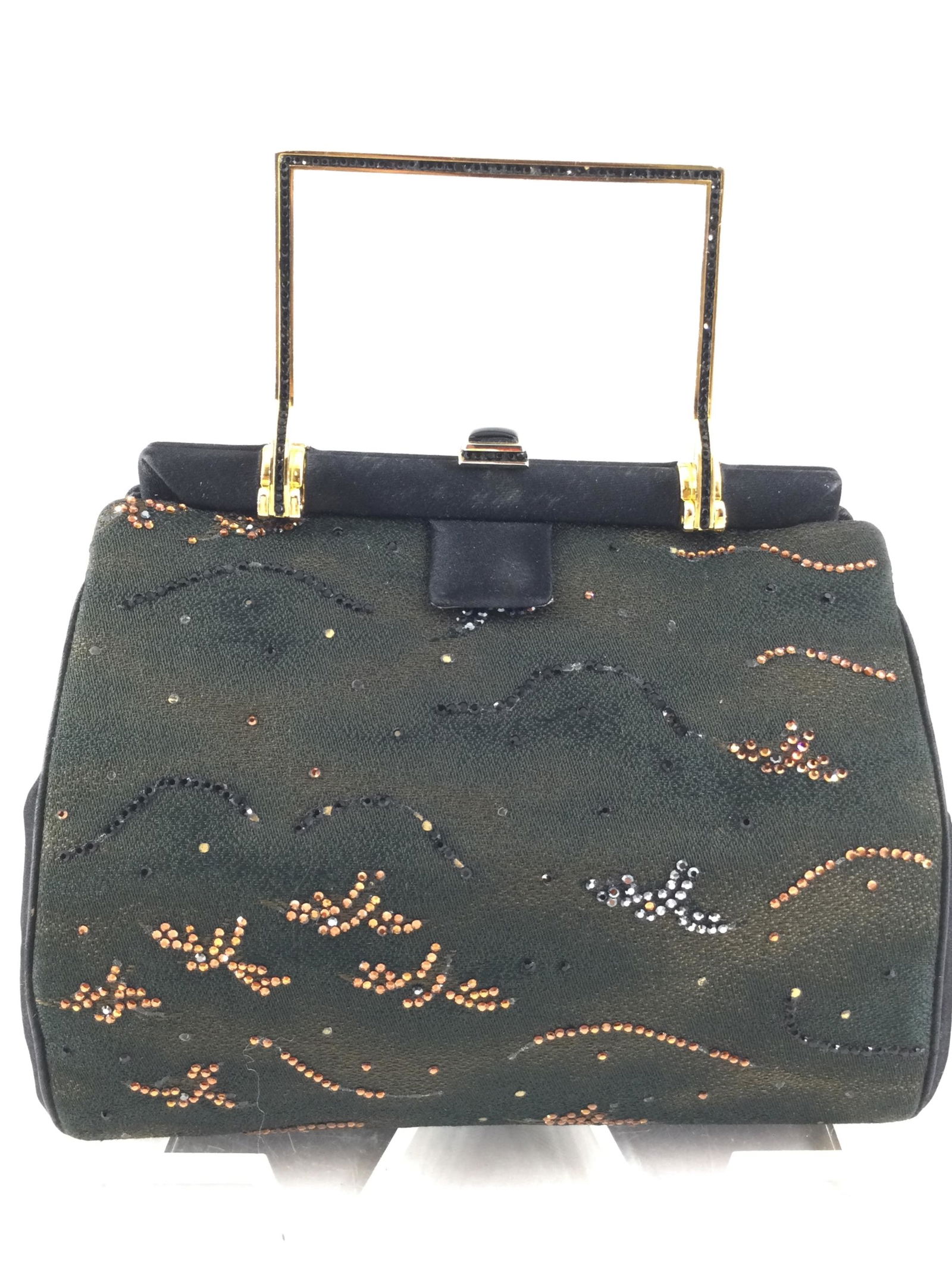 Vintage Judith Leiber Evening Purse: Vintage Judith Leiber Evening Purse with black and orange jeweled patterns throughout purse. Approx. size 6 inches tall x 7 wide x 2.5 deep. Approx. weight 11.1 oz. IMPORTANT: In House Shipping.