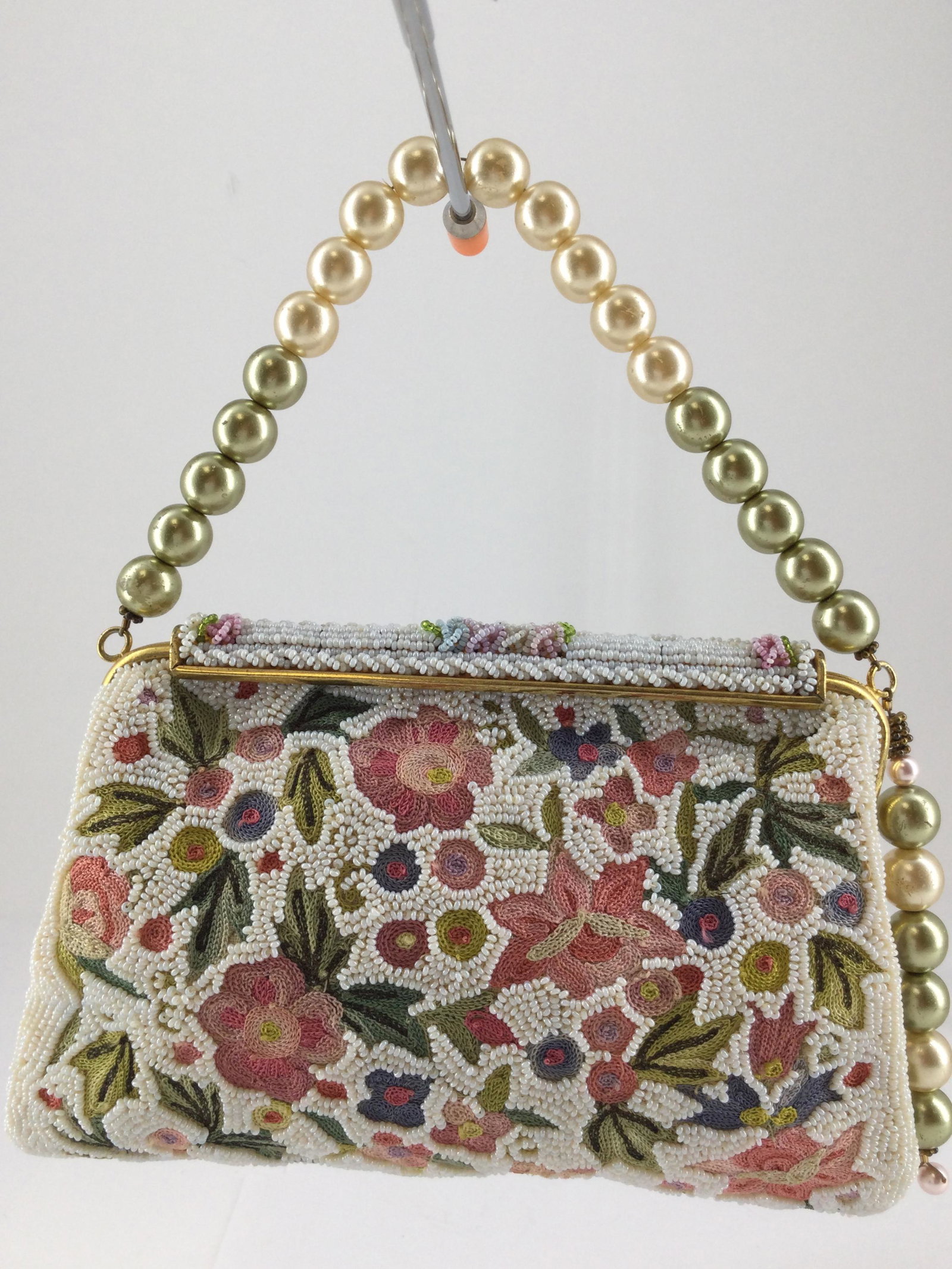 Vintage Handmade Beaded Leo Miller Handbag: Vintage Handmade Leo Miller Handbag White Beads with colorful floral designs. Approx. size 5 inches tall x 6.75 wide x 0.5 deep. Approx. weight 8.4 oz. IMPORTANT: In House Shipping.