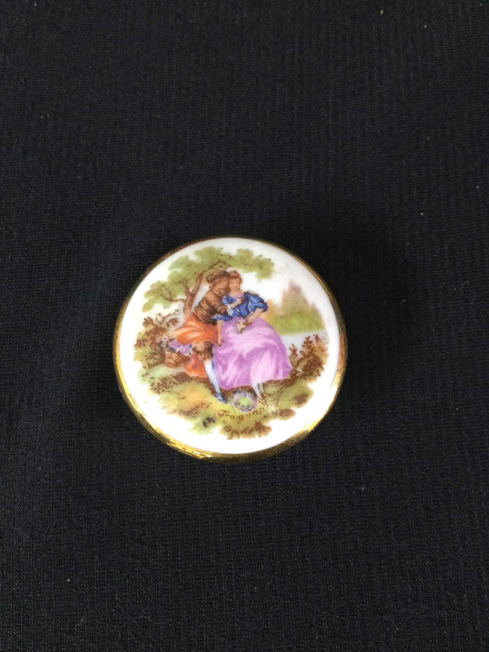 Vintage Limoges Porcelain Round Trinket Box Fragonard Scene: Ca. 1944-1973 Limoges Porcelain Round Trinket - Signed Fragonard. Approx. size 1-inch-tall x 1-5/8 round. Approx. weight 0.9 oz. IMPORTANT: In house shipping.