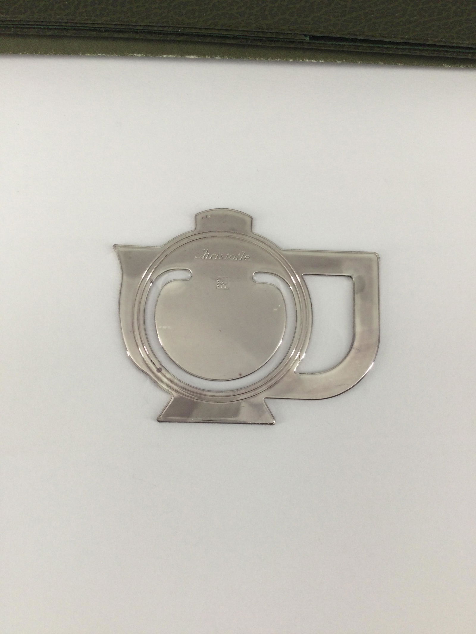 NEW Christofle Silver-plated Bookmark Teapot Shaped: NEW Christofle Silver-plated Bookmark Orig. Card/Envelope Teapot Shaped. Approx weight 5.4 grams. IMPORTANT: In House Shipping.