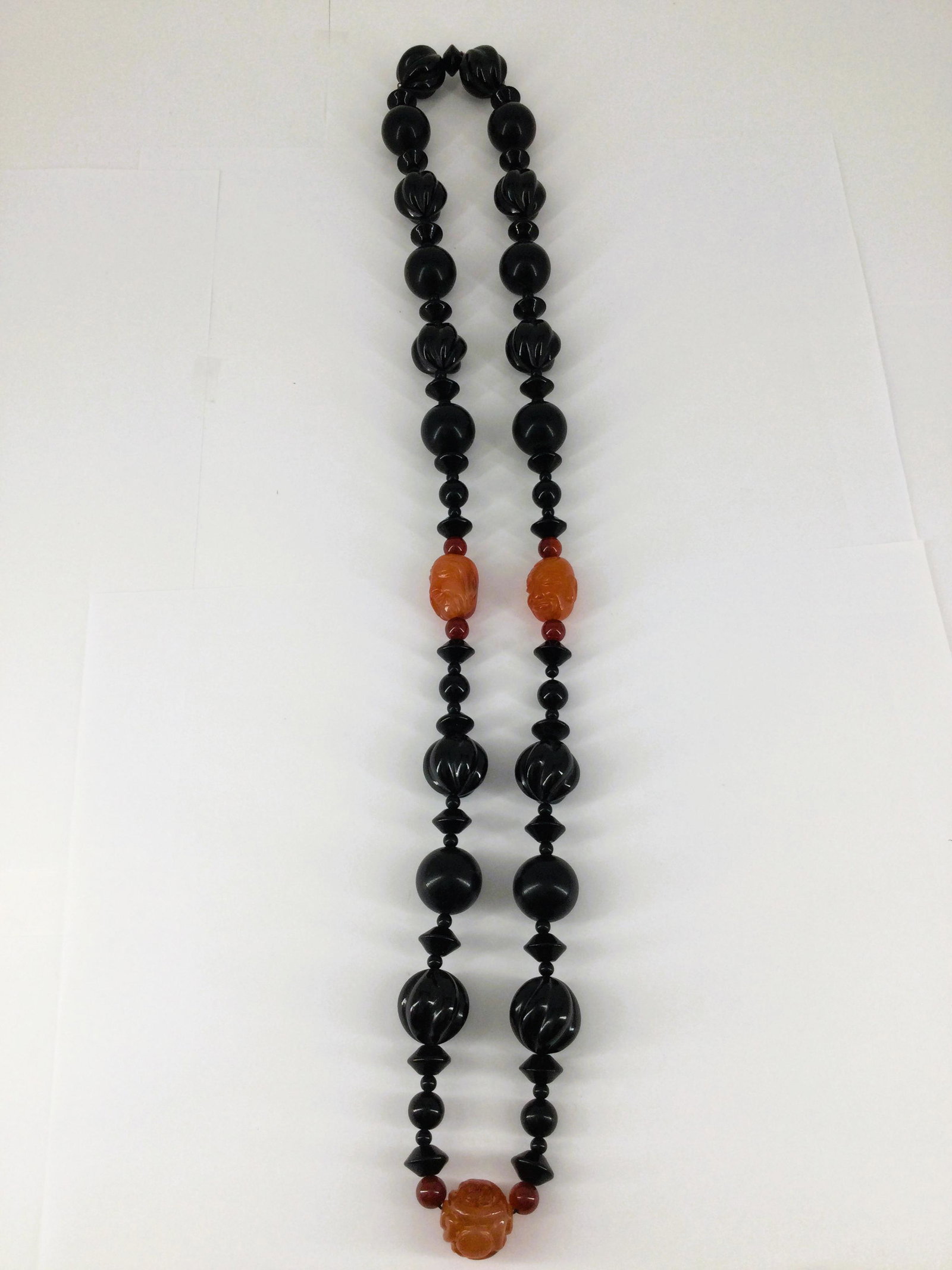 VTG. Chunky Carved Onyx & Carnelian Buddha Beads Necklace: VTG. Chunky Carved Onyx & Carnelian Buddha Beads Necklace. Necklace drop is that of 17" (no closure - so approximate total length is 34") - Onyx beads are nicely polished - some with a twist with smal