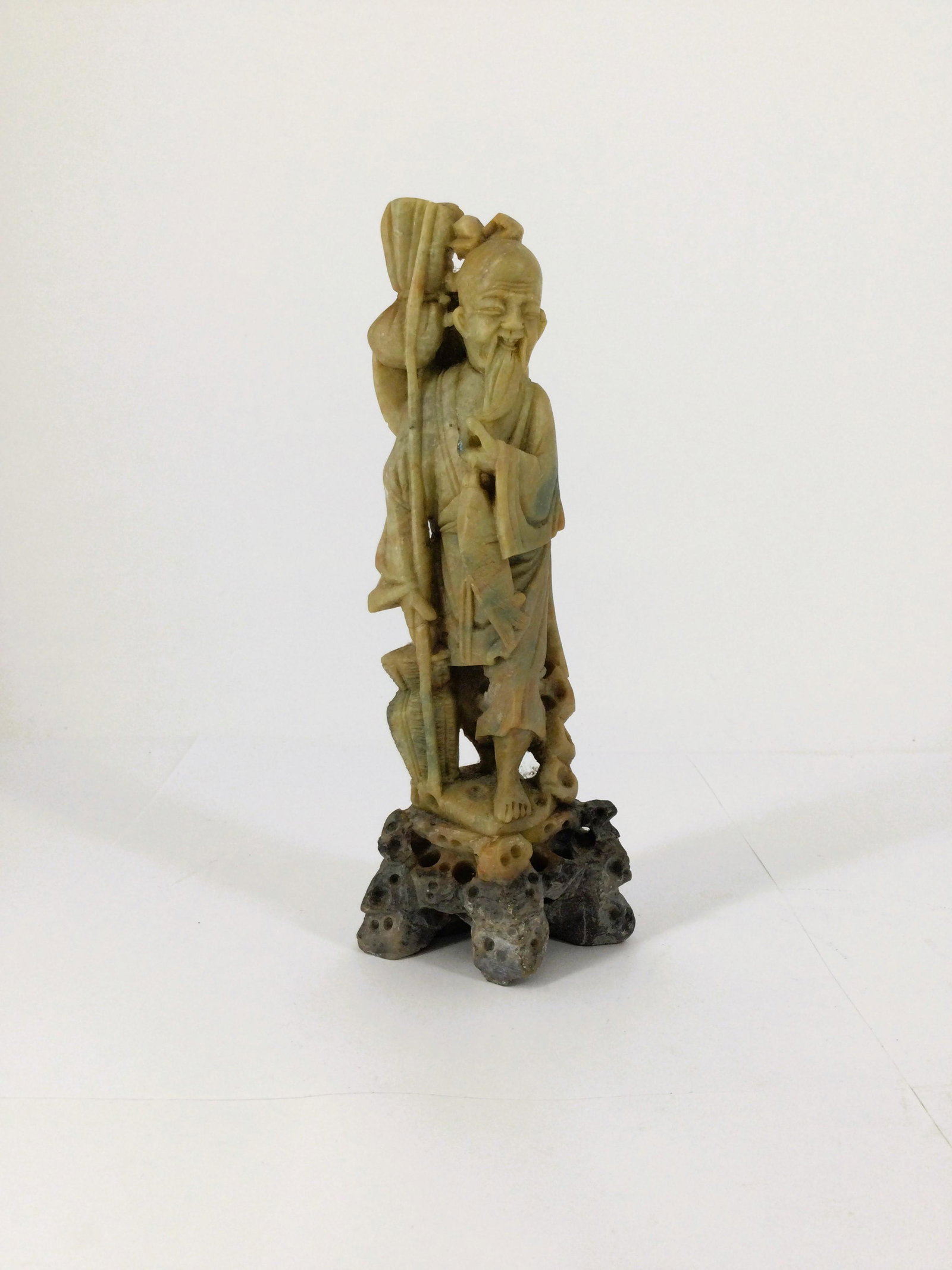 Chinese Hand Carved Soapstone Sculpture Fisherman: Chinese Hand Carved Soapstone Sculpture of a Fisherman . Approx. size 8 inches tall x 3 wide x 2 deep. Approx. weight 1 lbs. 0.2 oz. IMPORTANT: NO In-House Shipping, Please read our shipping terms for