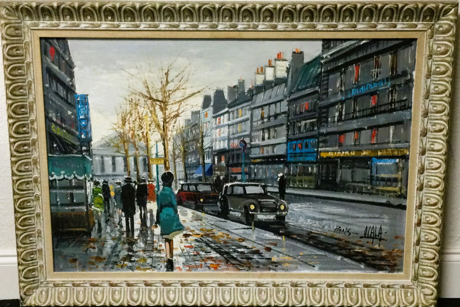 Parisian Scene Oil on Canvas Signed Ocala Titled Paris: Parisian Street Scene Oil On Canvas titled - Paris - depicting a busy street, Signed Ocala. Approx. size(frame) 30.5 inches tall x 42.5 wide, (art) 23.5 tall x 35 wide. Approx. weight 9 lbs. 7 oz. IMP