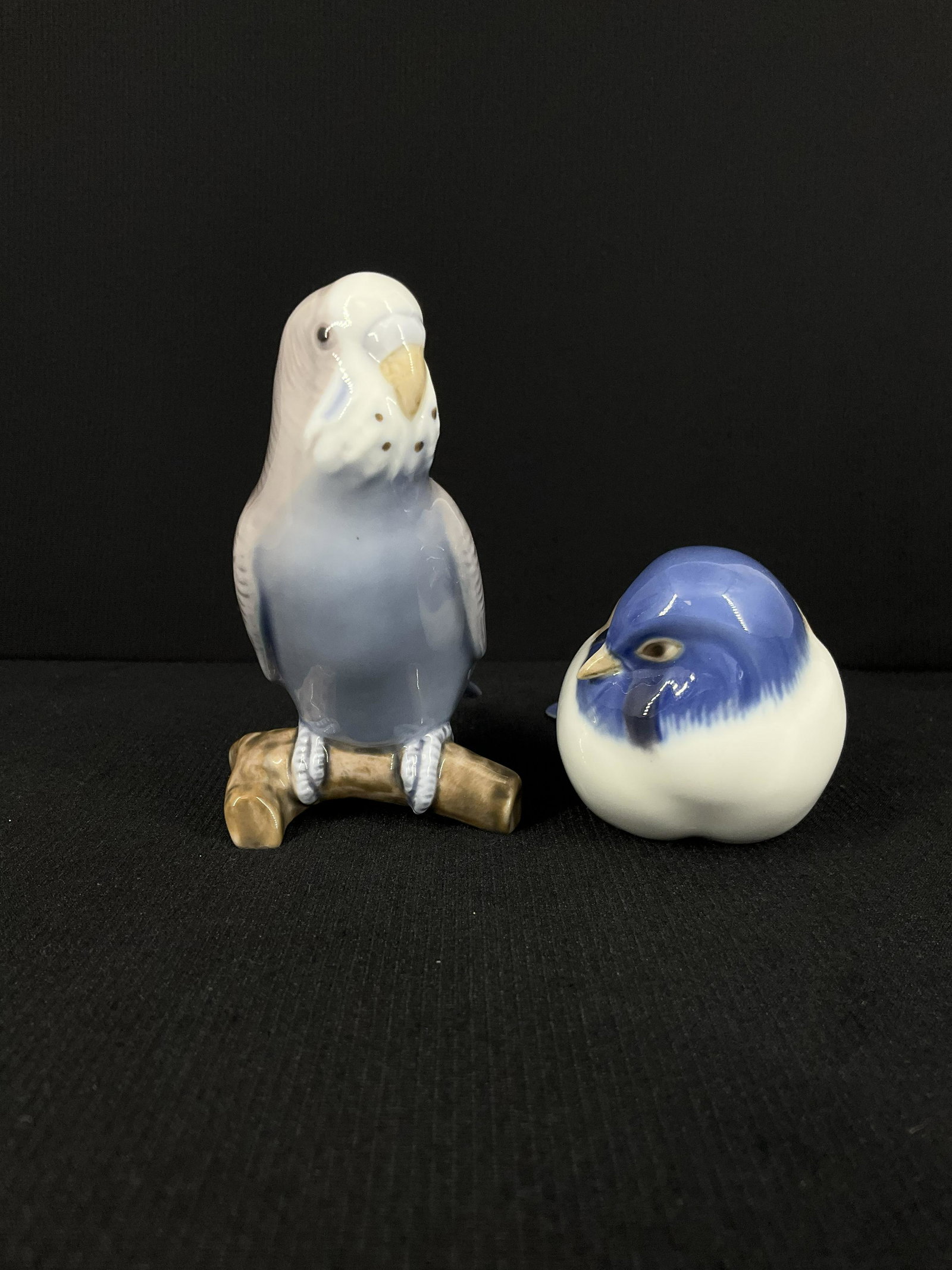 Pair of Bing and Grondahl Denmark Porcelain Bird Figurines: Pair of Bing and Grondahl Denmark Porcelain Bird Figurines.Budgerigar Parakeet Blue Bird 2210. Titmouse-Pessimist 1635. Approx. size 4 inches tall x 2.5 wide x 5 deep. IMPORTANT: NO In-House Shipping,