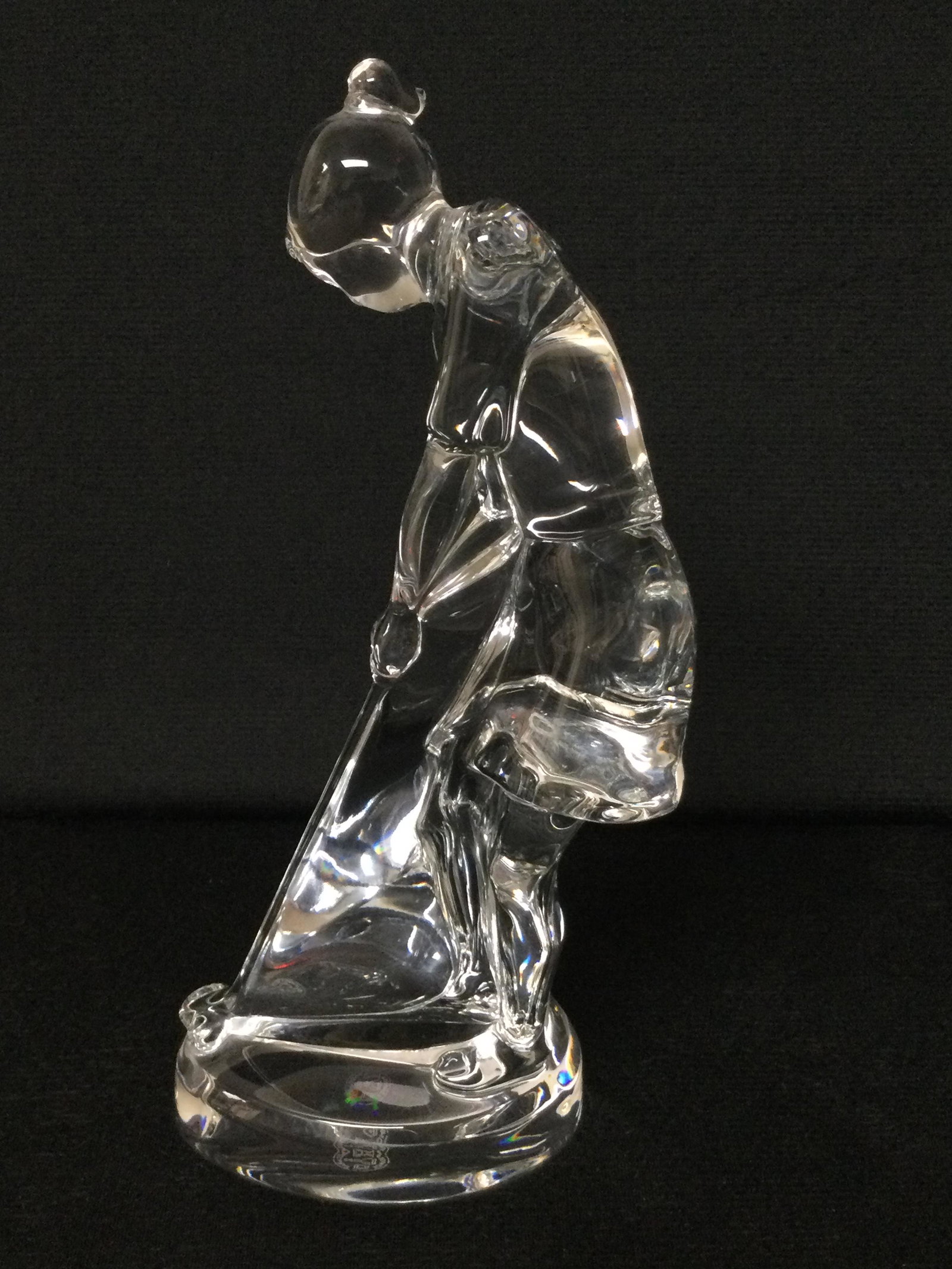 Baccarat Woman Golf Sculpture: Baccarat woman golf sculpture prepping to hit with her driver. Approx size. 9 inches tall x 2.5 wide x 4 deep. Approx. weight 2 lbs. 3 oz. IMPORTANT: NO In-House Shipping, Please read our shipping ter