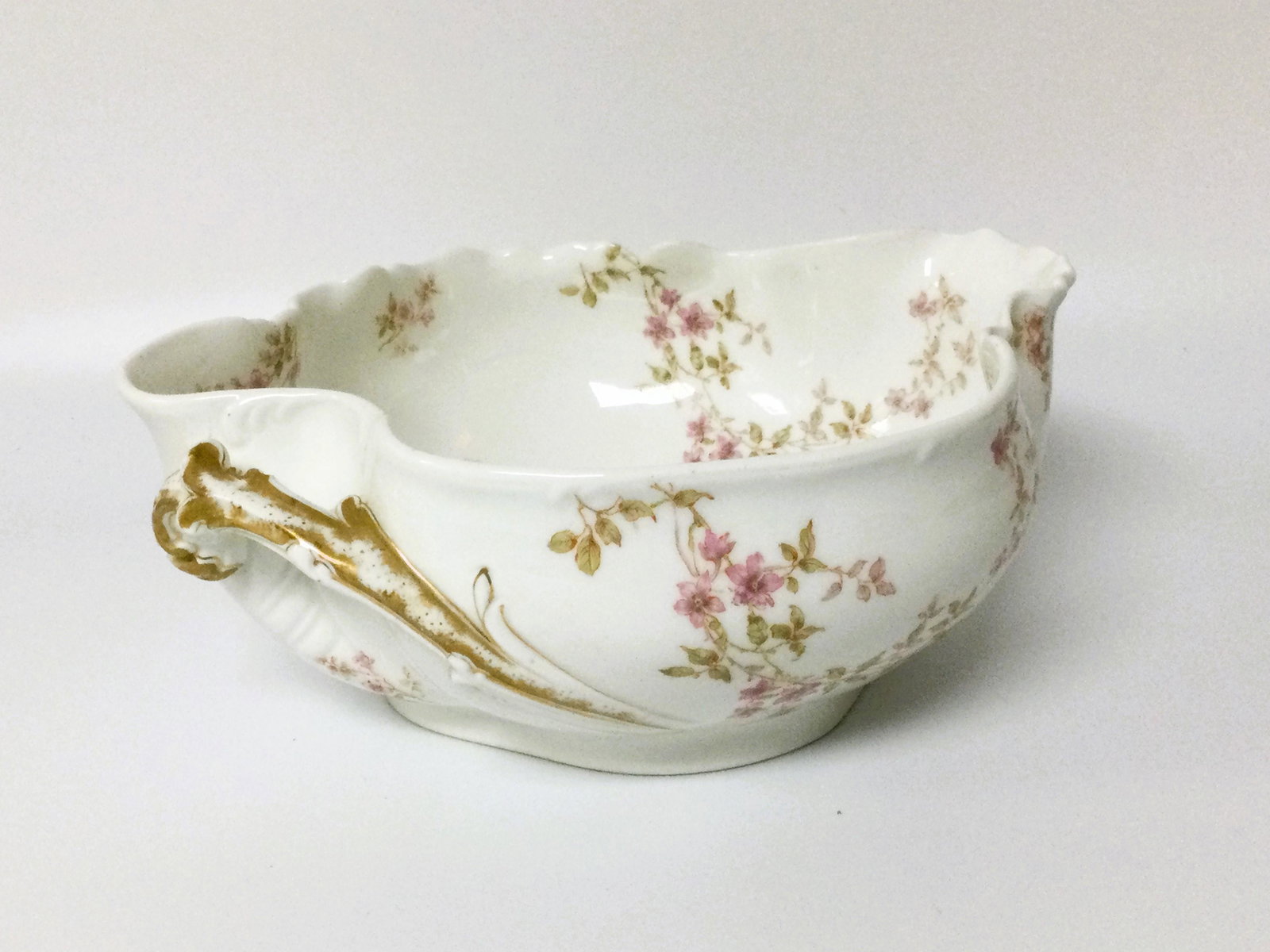 Antique Haviland Limoges France Serving Bowl: Antique French Haviland Limoges, single handle Serving Bowl, stamped on bottom, Floral pattern. Approx. size is 4 inches tall x 9.75 inches across. IMPORTANT: NO In-House Shipping, Please read our shi