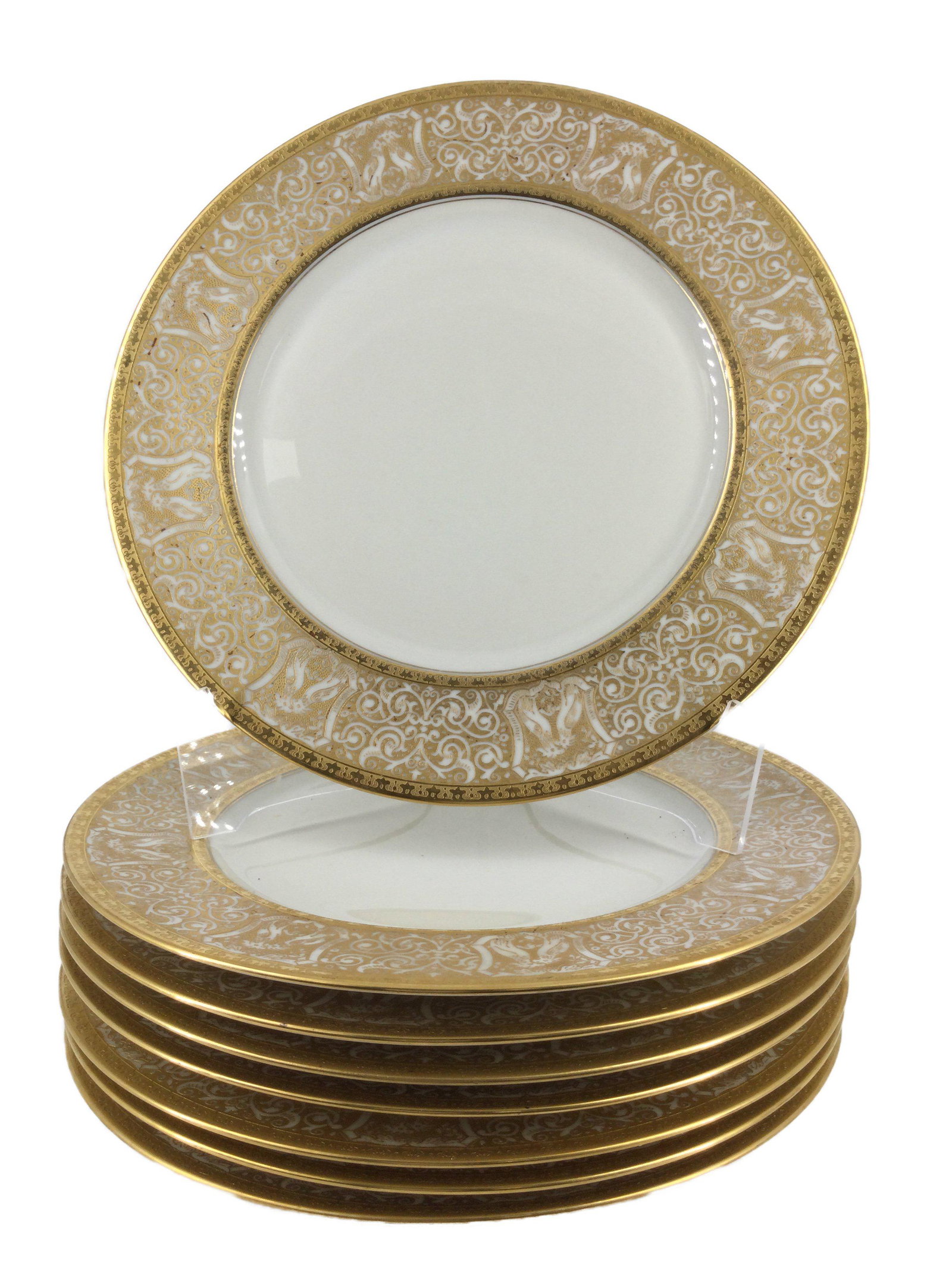 Heinrich and Co. Gold Encrusted Dinner Plates 8pc.: Lot of 8 Heinrich and Co. Seleb Bavaria Porcelain dinner Plates with intricate gold encrusted patterned design along the outer area of the dish. The stamp on the back dates back to 1930. Approx. size