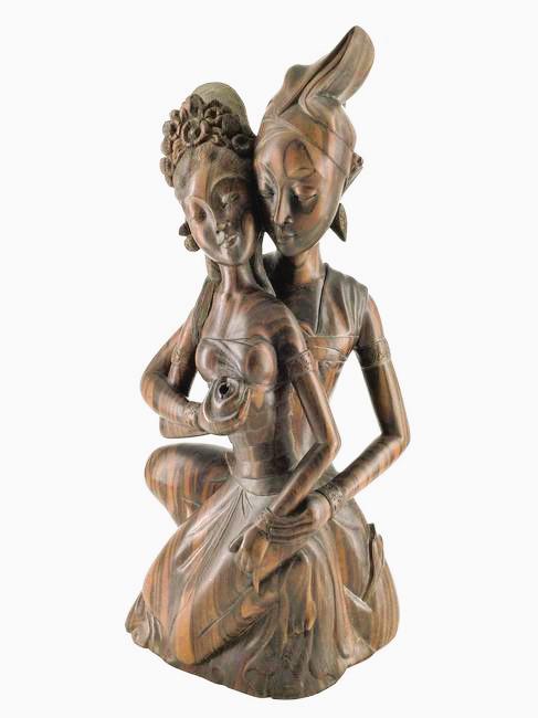 Polynesian Carved Ironwood Sculpture: Carved Polynesian couple embracing Ironwood sculpture from Sunar, Bali Signed I.B. Catra. Approx. size 18 inches tall x 9.5 wide x 4.5 deep. Approx. weight 10 lbs. 5 oz. IMPORTANT: NO In-House Shippin