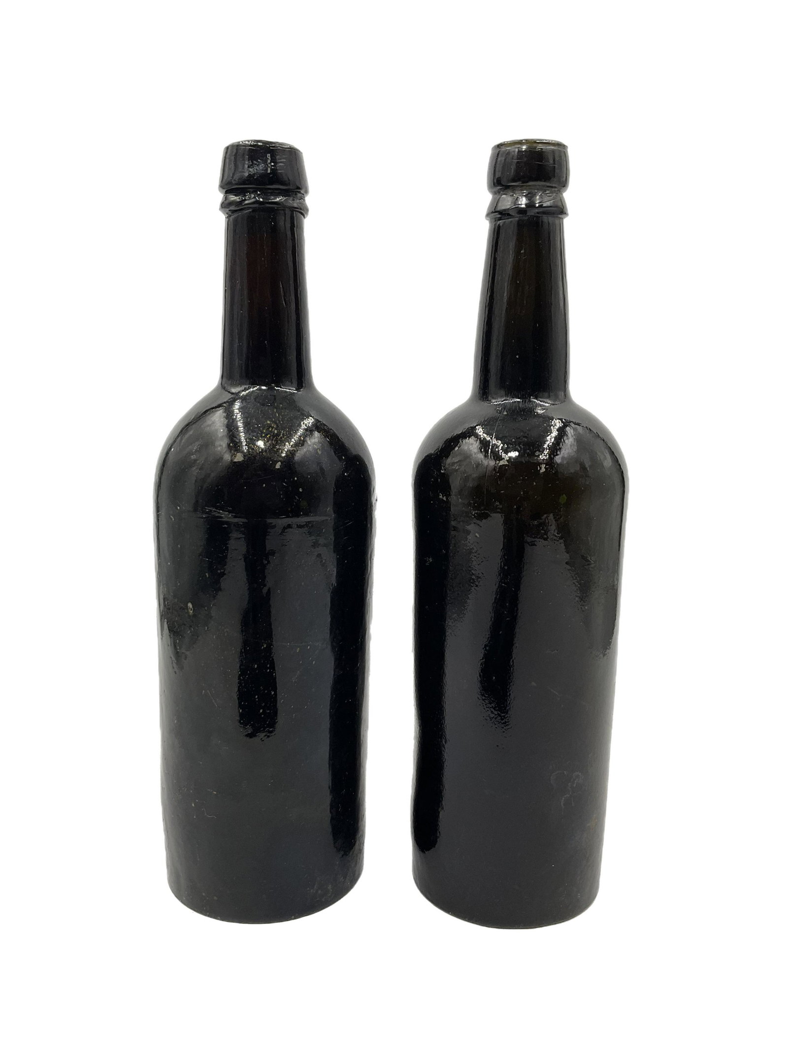 Pair of Antique Black Glass Bottles - Sol: Pair of Antique Black Glass Bottles. Approx. size 10.75 inches tall x 3 wide. Approx. weight total 3 lbs. 2.8 oz. IMPORTANT: NO In-House Shipping, Please read our shipping terms for provider.