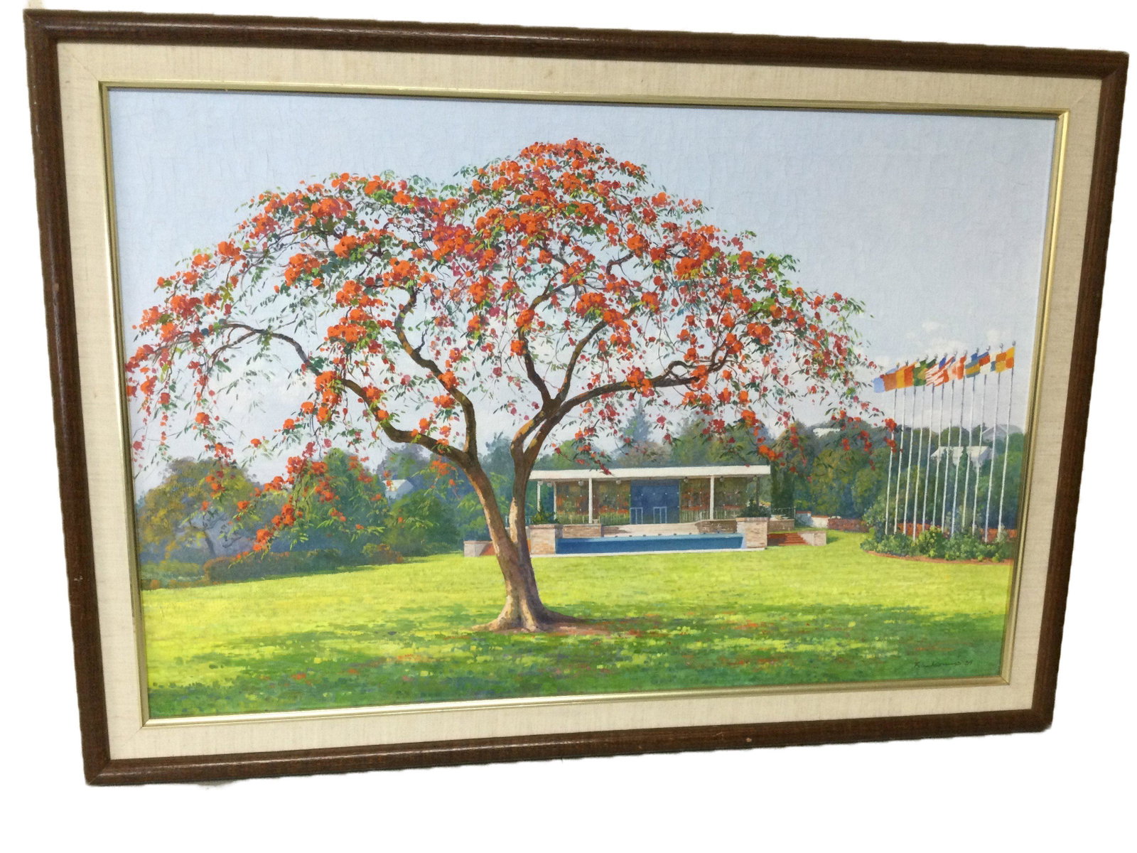 1984 Oil on Canvas of Flamboyant Tree Signed: Felix R. (Illegible Last Name) Oil on Canvas Signed and dated 1984 depicting a Flamboyant tree with red and orange flowers near a small building next with a row of different national flags, this art u