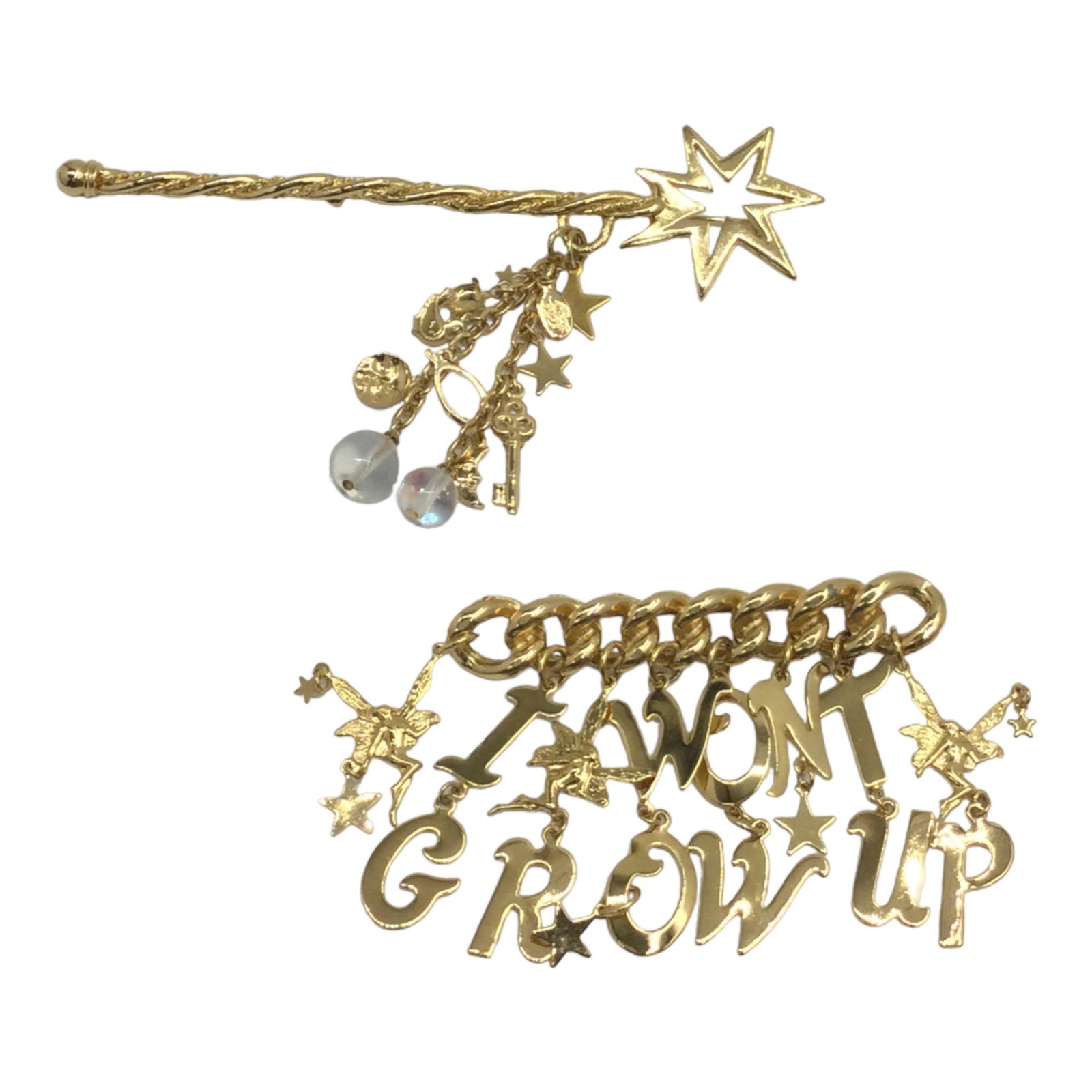 Pair of Kirks Foley Brooches: Pair of Kirks Foley Brooches. Wand with trinkets 5.25 inches long x 1.25 wide. Chain Link bar 'I WONT GROW UP' with fairies 2.75 tall x 3 wide.