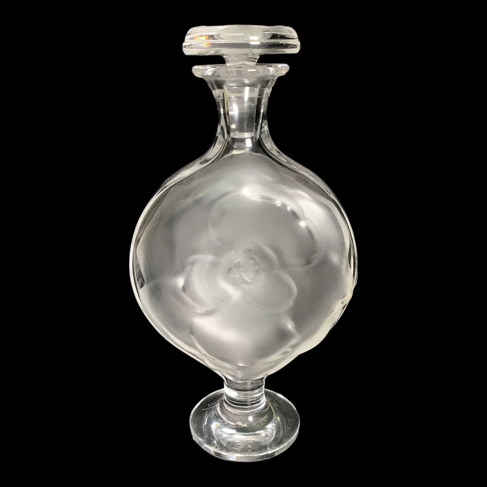Lalique 'Moulin Rouge' Crystal Perfume Bottle: A Lalique Crystal perfume bottle in a clear and frosted foundation, designed with the 'Moulin Rouge' pattern, and marked along the underside 'Lalique France' CIRCA: 20th Cent. ORIGIN: France IMPORTANT