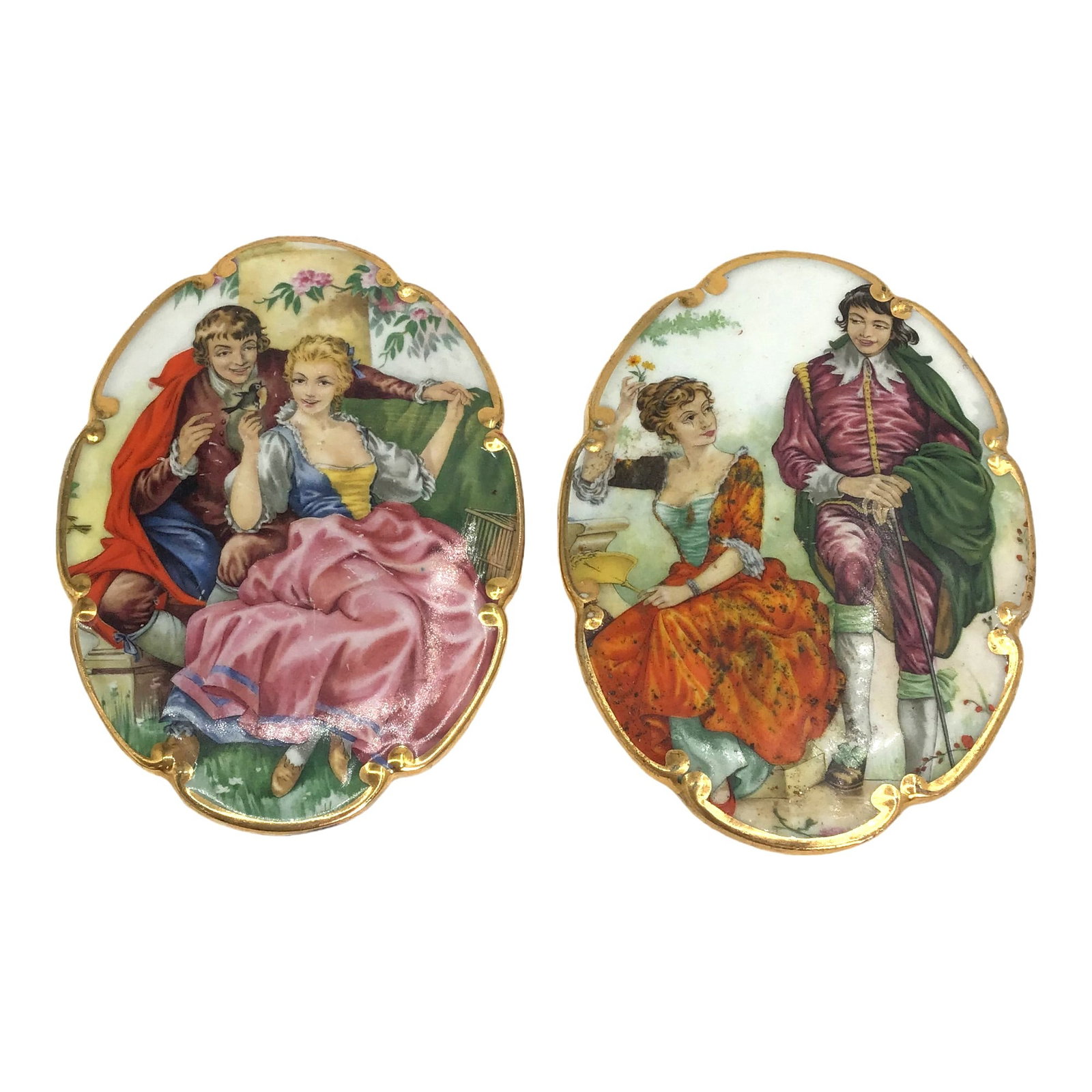 Pair of Hand Painted Porcelain Medallions: Pair of Hand Painted Porcelain Medallions depicting men and women in vibrant colored clothing sitting on a couch with a bird and playing with a flower. IMPORTANT: NO In-House Shipping, Please read our