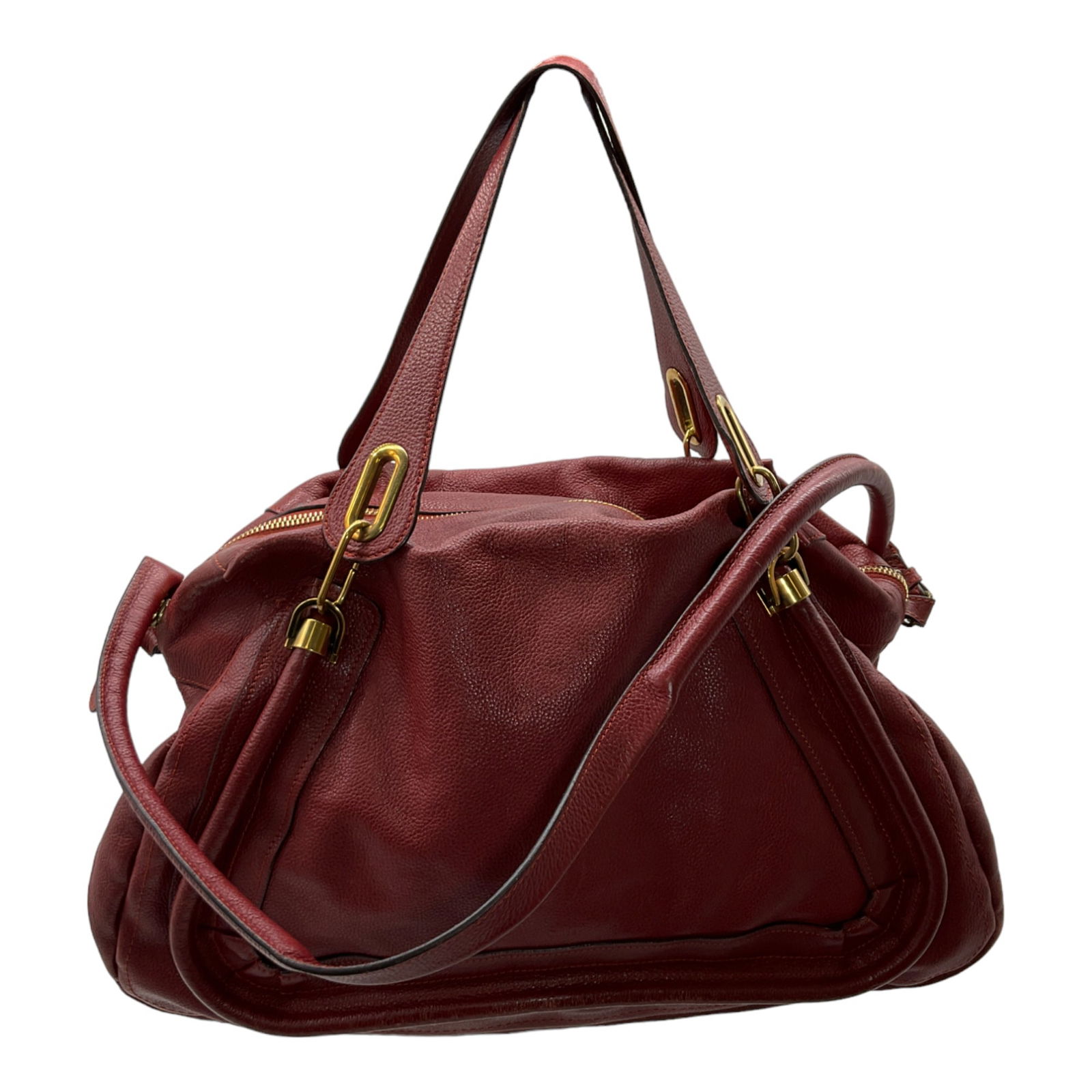 Red Travel Bag by Chloe: Red Leather Travel Bag by Chloe. Double handled and removable strap. Handles drop 7.5 inches, removable strap drops 16 inches, bag is 13 inches tall x 18 inches wide.