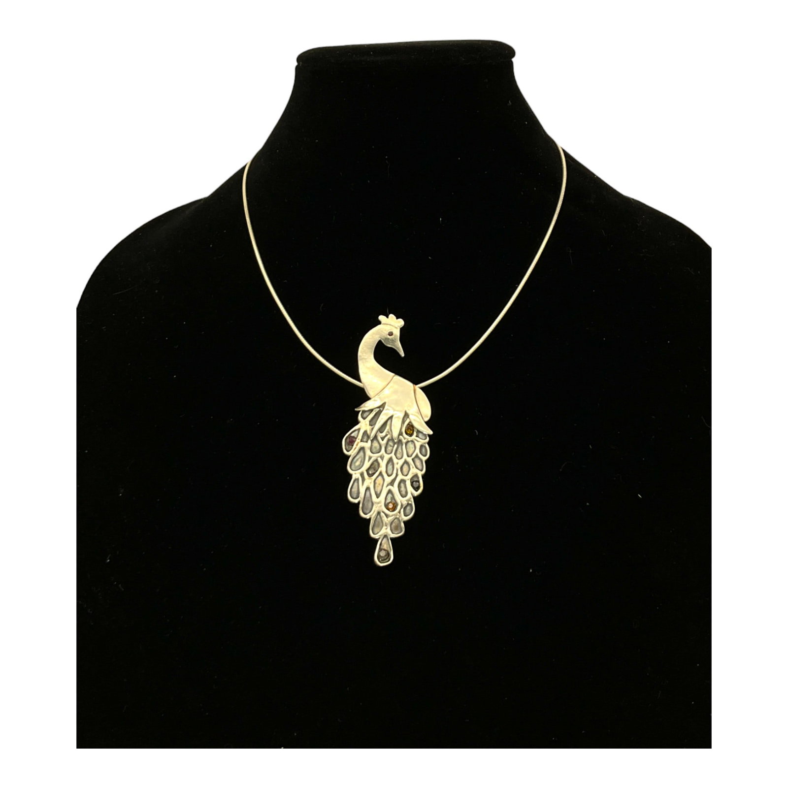 .999 Fine Silver Peacock Pendant With Necklace: .999 Fine Silver Peacock Pendant with .925 Necklace, Peacock is adorned with stones in some of the feathers. Necklace 18 inches end to end, pendant 3.5 tall x 1.25 inches at widest.