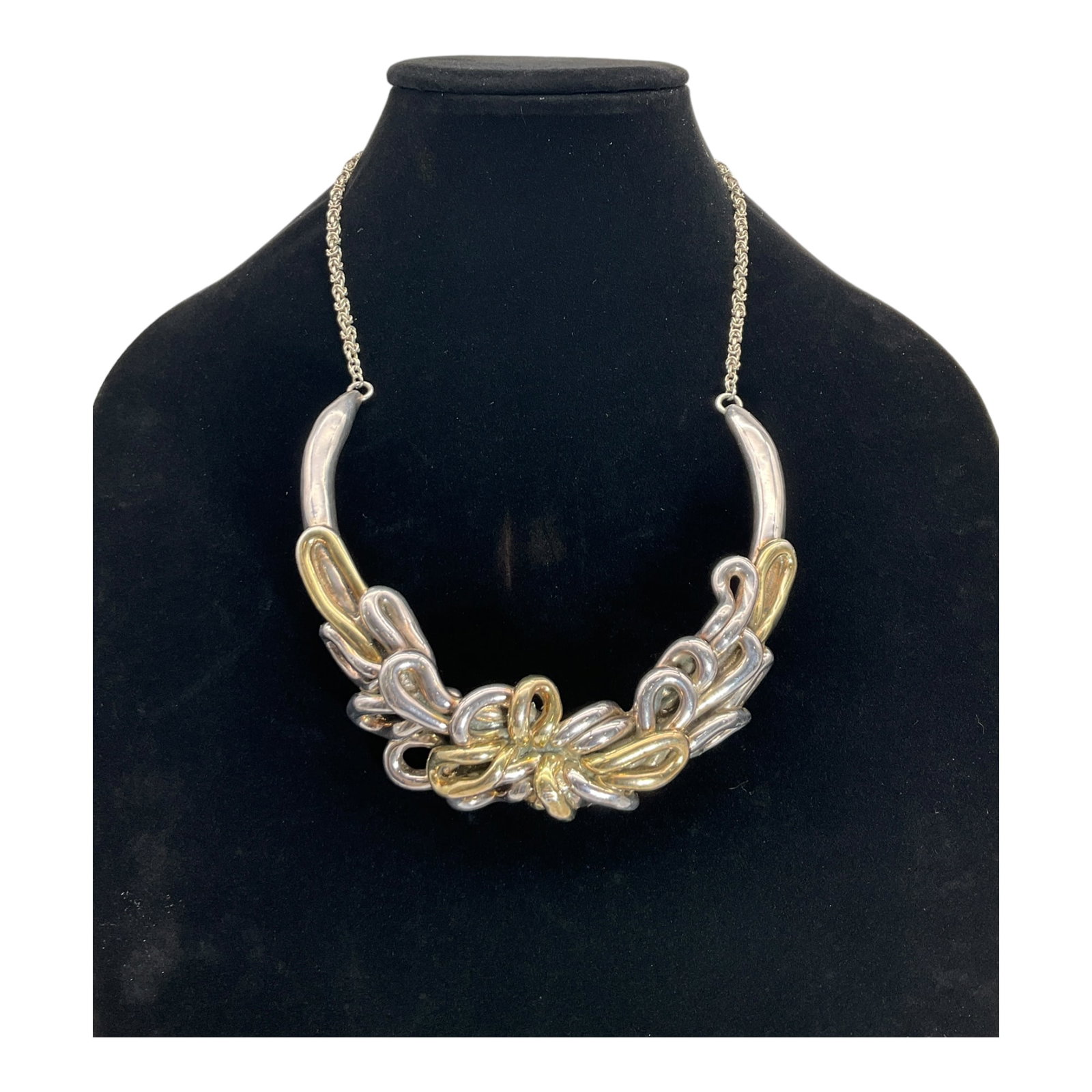 925 Abstract Bib Style Necklace: Stamped 925 RDM at closure, Abstract Floral Center Bib Style Necklace. Approx.. 17 tip to tip, with a U shaped for Floral bib that is approx. 4 inches wide and drops 4.5 inches.