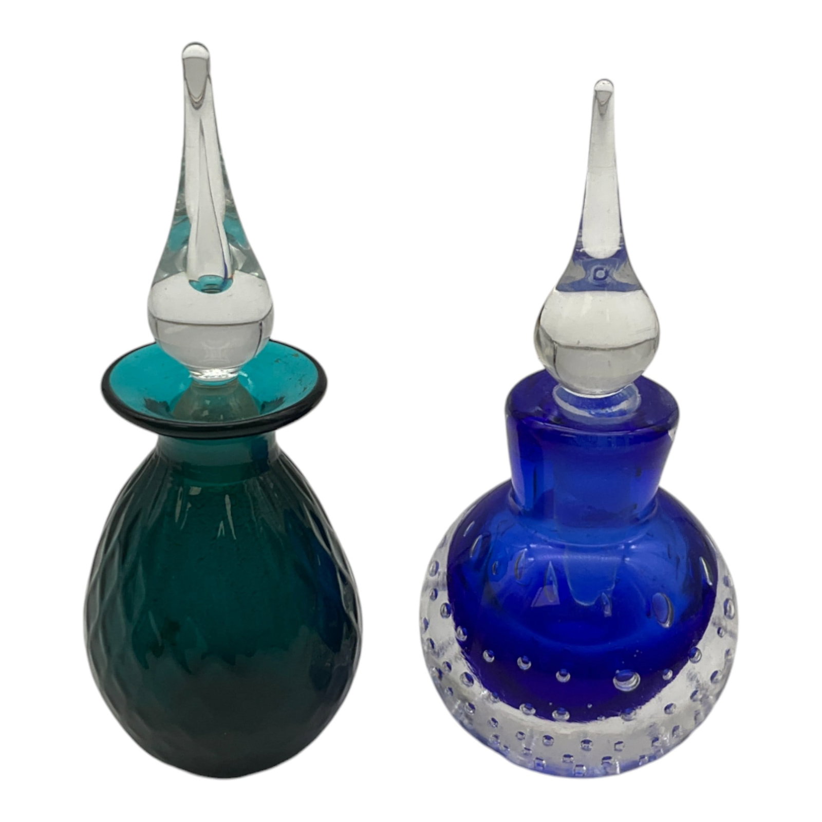 Pairpoint Art Glass Perfume Bottle & Indigo Bullicante Cased Art Glass Perfume Bottle with Stoppers: Pairpoint Green Art Glass Perfume Bottle & Blue Bullicante Cased Art Glass Perfume Bottle with Stoppers. Both Are Approx 6 Inches Tall. Stopper for Pairpoint has slight chip inside.