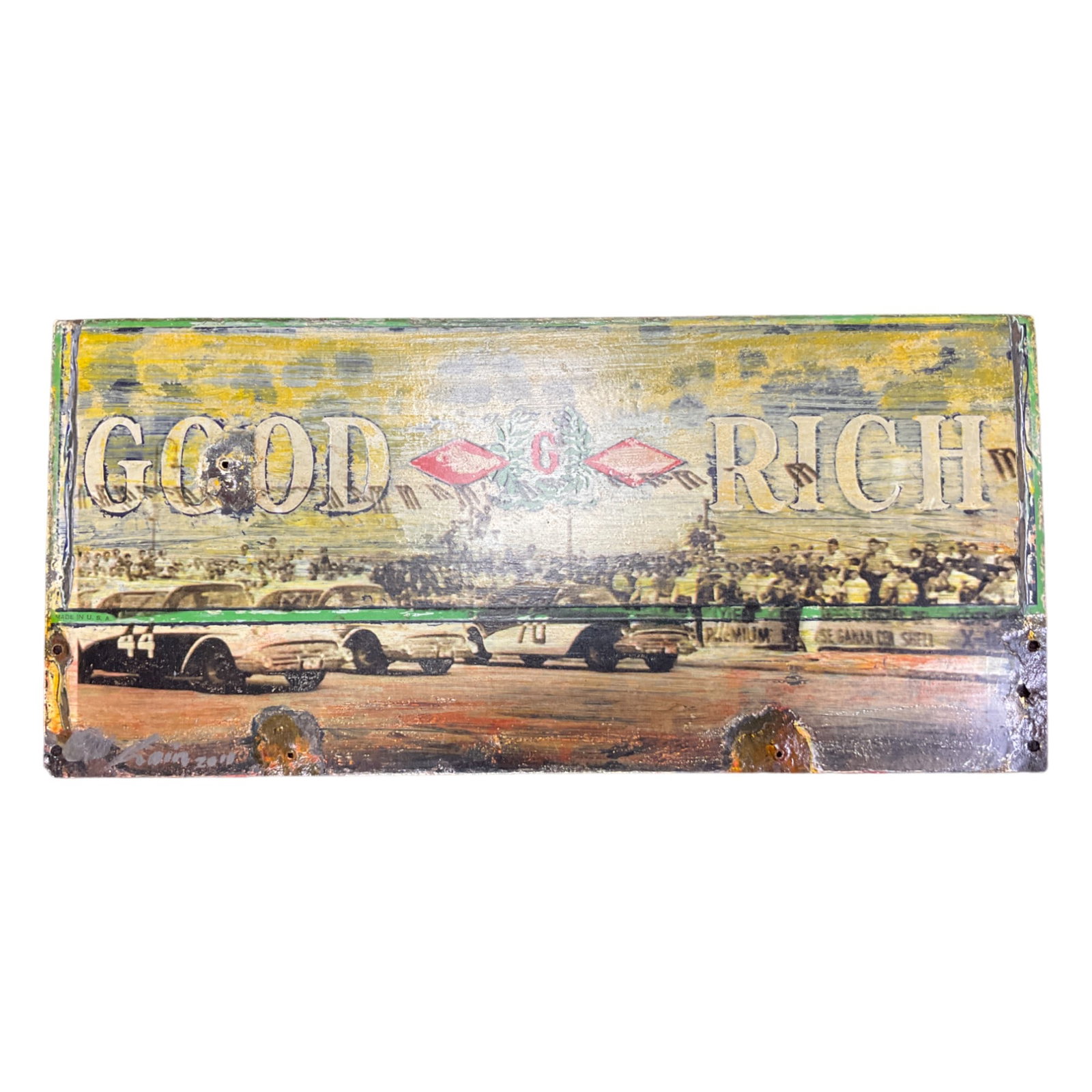 2011 Signed Goodrich Racing Metal Art Sign Mixed Media: A 2011 Illegibly signed Mixed Media Metal Sign Art, depicting Goodrich Advertising. Obtained by previous owner on a trip to Cuba . Approx. 12 Inches tall x 26 wide, 5.10 lbs.