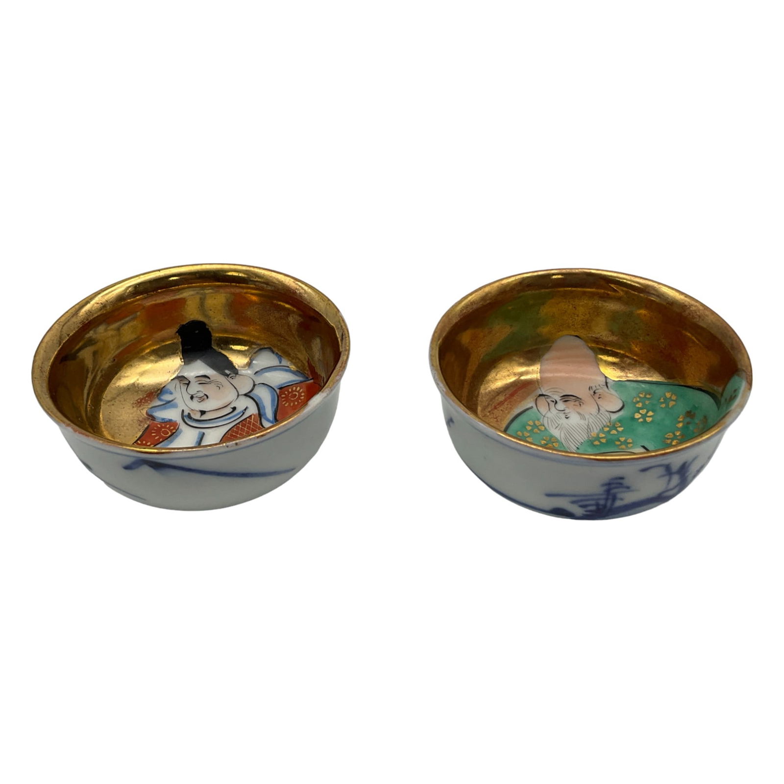 Pair Japanese Porcelain Sake Cups: Pair Japanese Porcelain Sake Cups with the insides depicting 2 of the 7 Gods of Fortune. Approx. 1 Inch tall x 2 across, 2.2 oz.