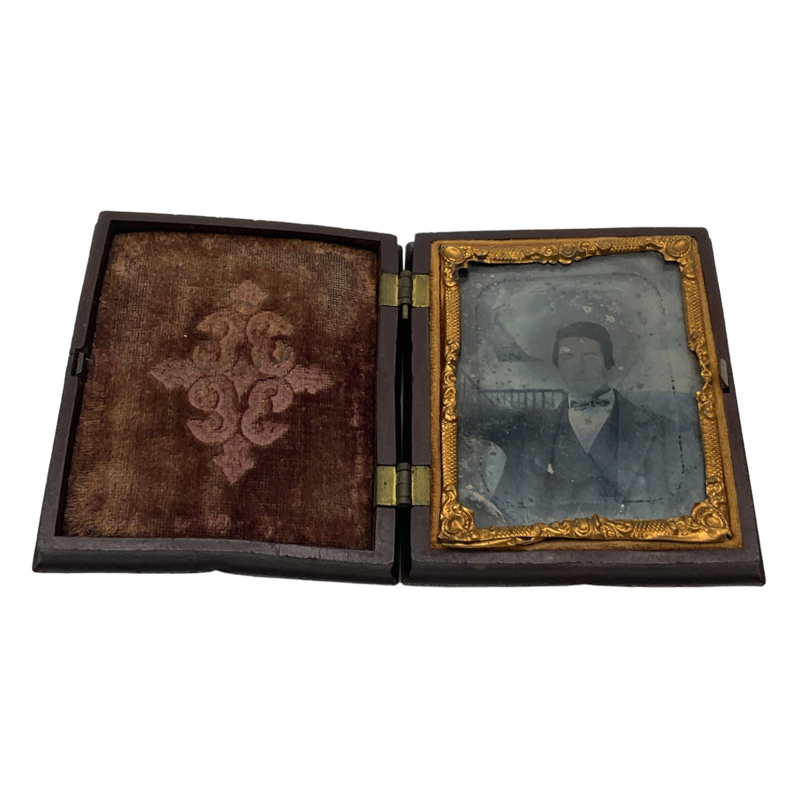 Antique Ambrotype photo of a Gentleman: Antique Ambrotype photo of a Gentleman in Gutta Percha Case. Approx. 3 inches tall x 2.5 wide x 0.5 deep, 3 oz.