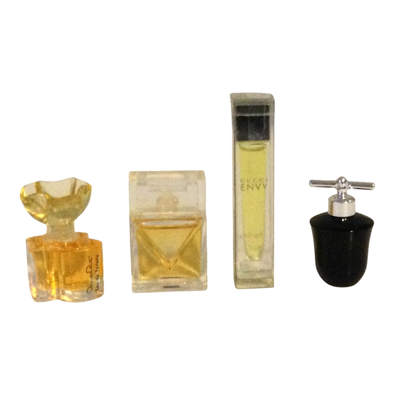 Lot of 4 Mini Fragrances: Lot includes; Envy 3 ml by Gucci (Full), Michael Kors 3.5 ml (Full), Vivid 1/8 oz (Full), Oscar de la Renta .13 oz (Full).