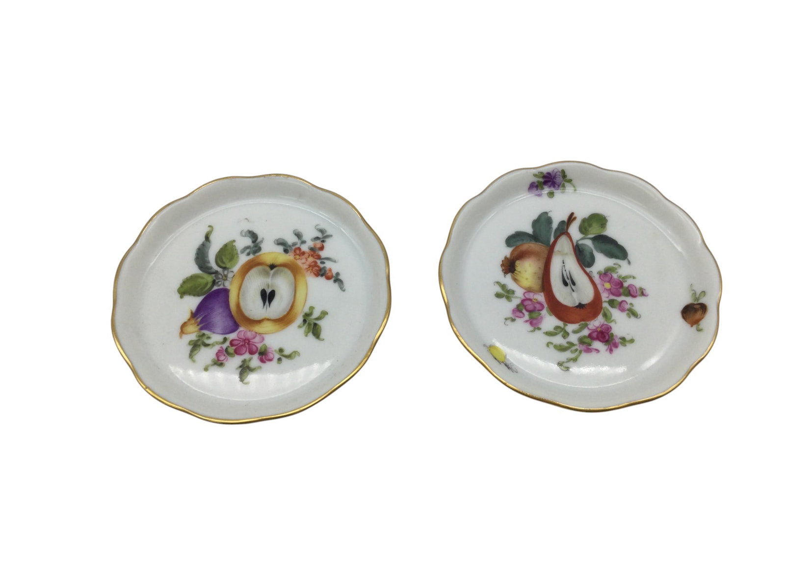 Pair Herend Pin Dishes Hungarian Porcelain c. 1920-1930: Pair Herend Pin Dishes, Hand Painted Hungarian Porcelain,Fine China model 7563/bfrn cut fruit and flowers, trade marks dates 1920's-1930's. Approx. 3 Inches across, 2.2 oz. together.